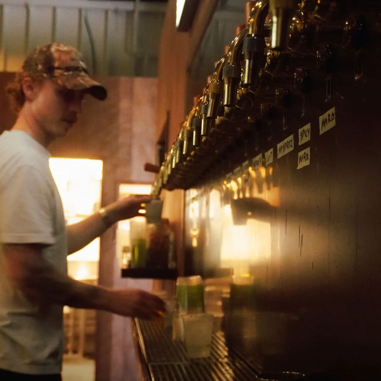 Bartender pouring a kegged cocktail at Norma Taps bar