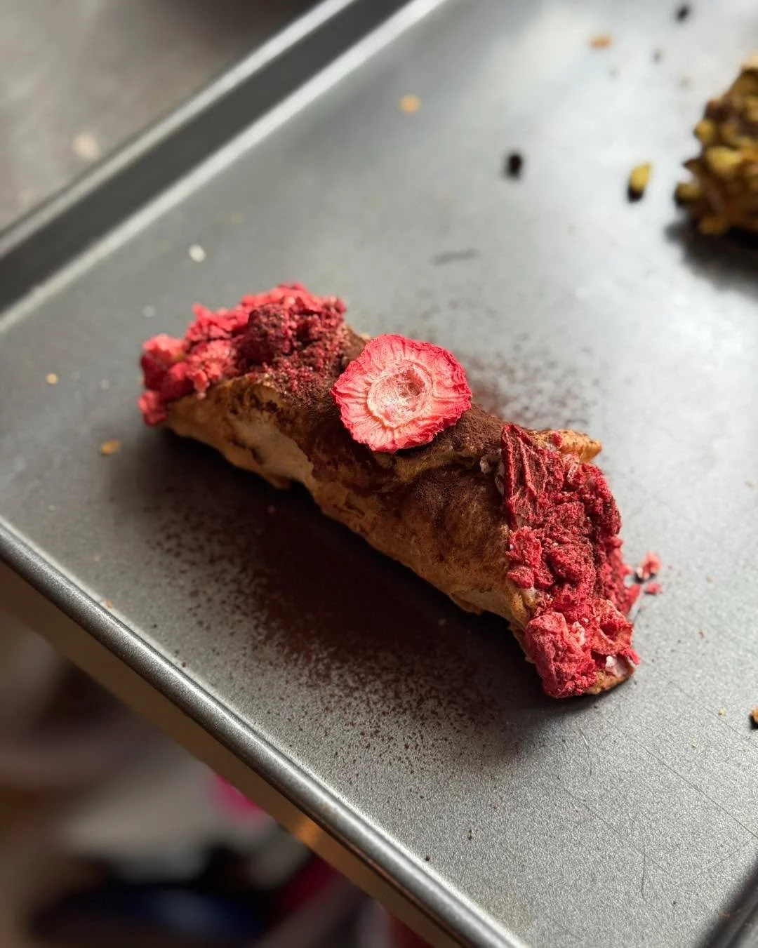 Working on a new cannoli flavor. I don&rsquo;t have a name for it quite yet, but this is all it entails:

A crunchy cannoli shell filled with a chocolate chip ricotta filling, topped with dried strawberries, cocoa powder, &amp; a dried strawberry sli