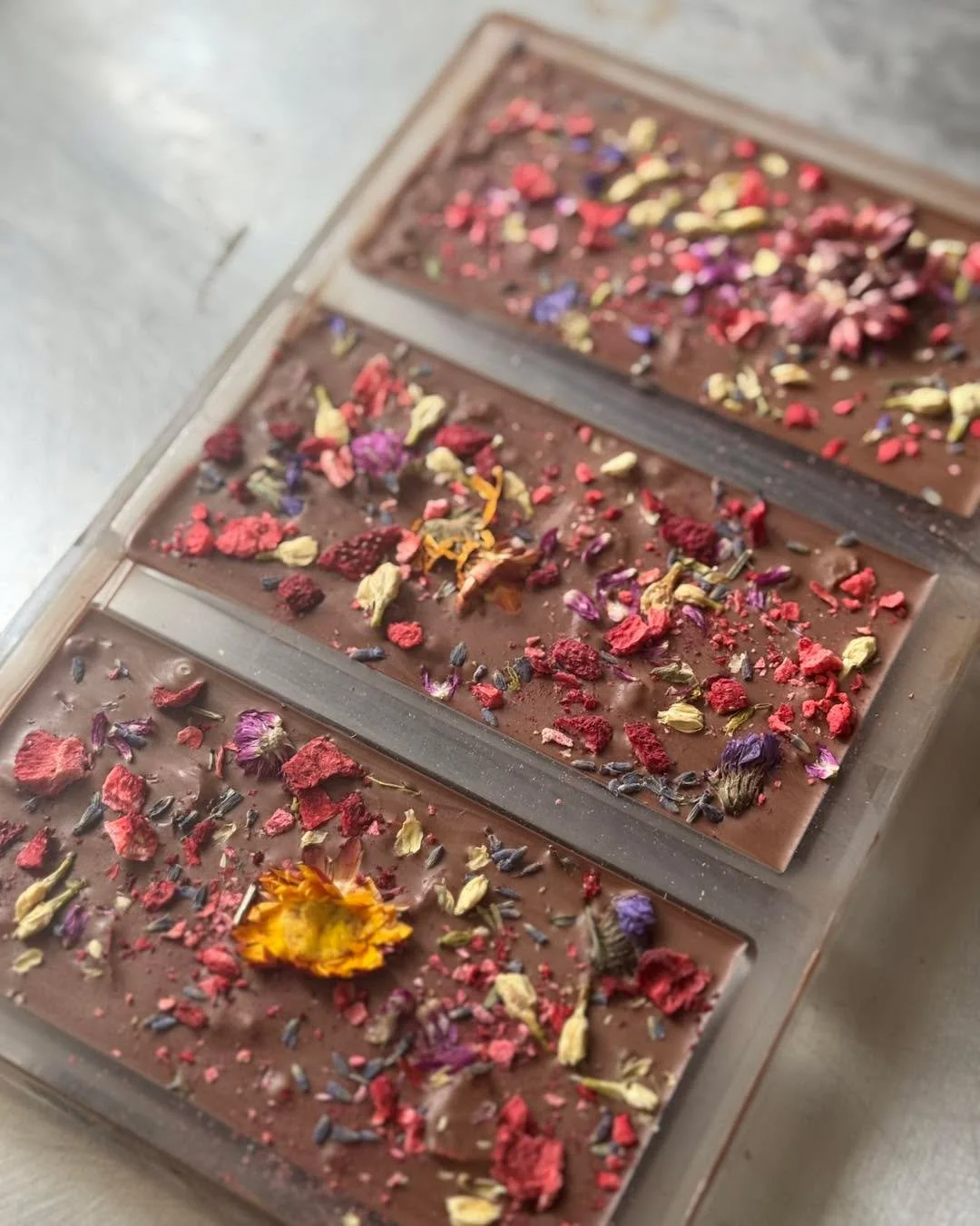 My favorite part of the process of rolling out new items is that I come up with other snazzy creations too! Like these!

Strawberry Floral Bar : 
- Belgian milk chocolate with an assortment of dried flowers &amp; strawberries

Caramel Coins :
- Belgi