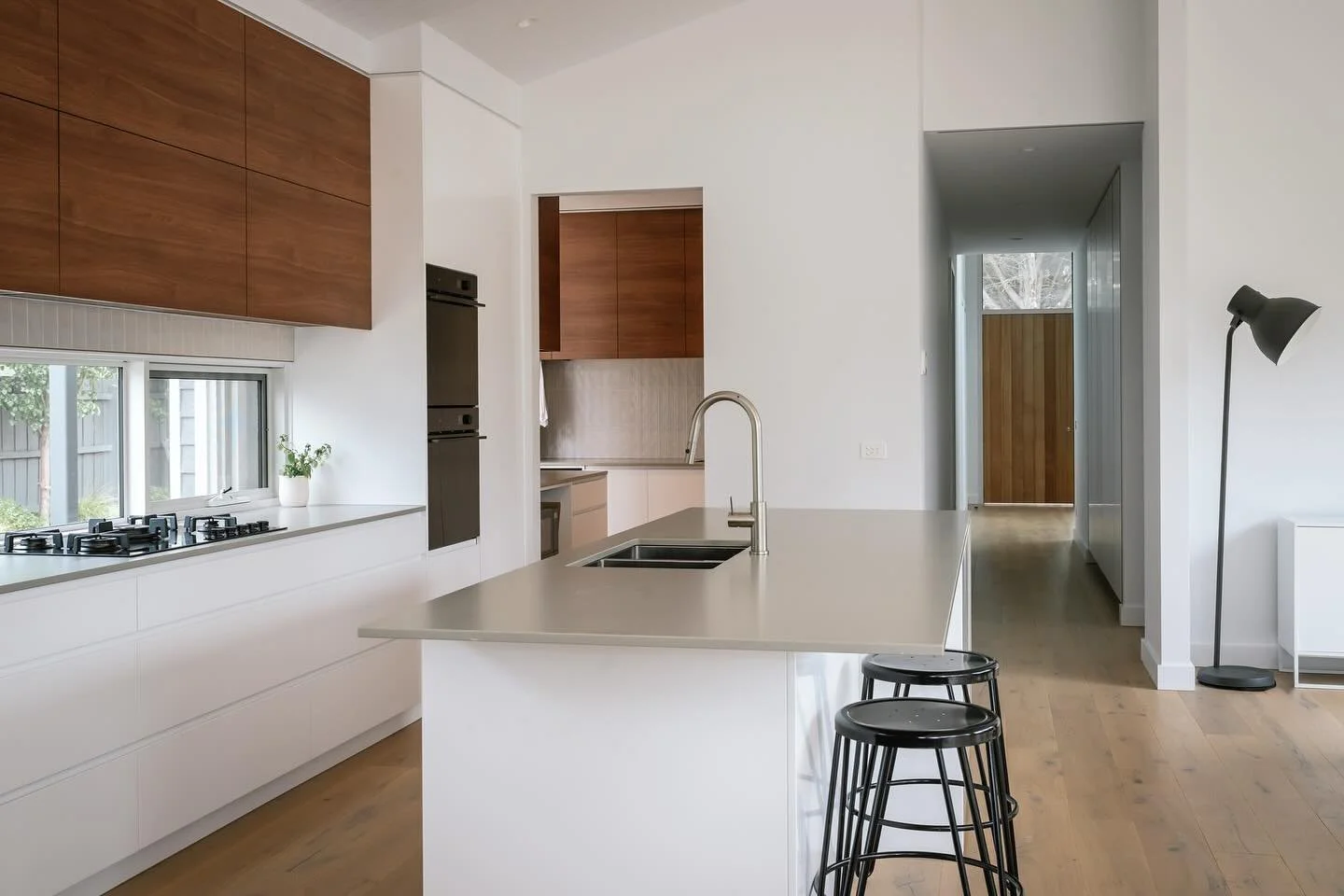 Tucked to the side of the kitchen, a walk-through butler&rsquo;s pantry connects directly to a laundry and mudroom style entry &mdash; designed with everyday life in mind, from muddy boots to school bags and groceries. 

Washed oak floors pair with c