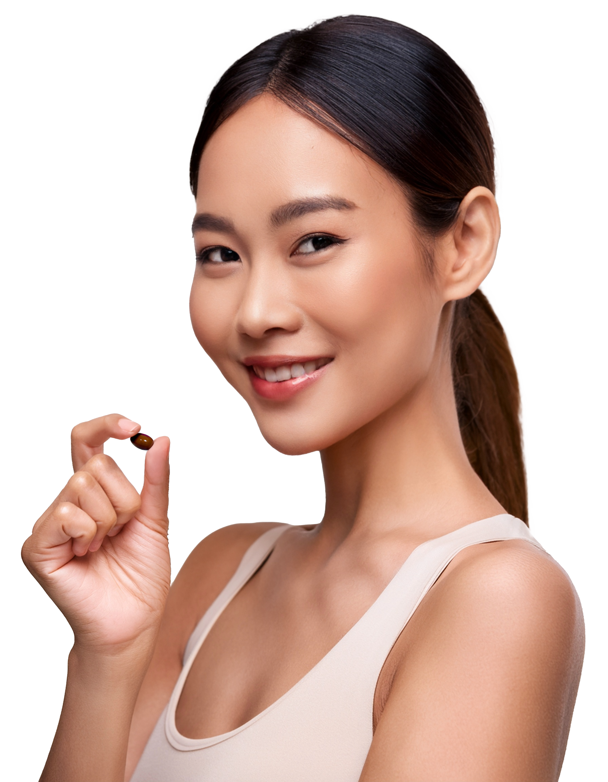 Young woman with brown hair pulled back, holding a small brown capsule and smiling at the camera.