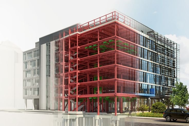 Modern multi-story office building with exposed red steel framework and glass exterior, with landscaping and a parked car in front.