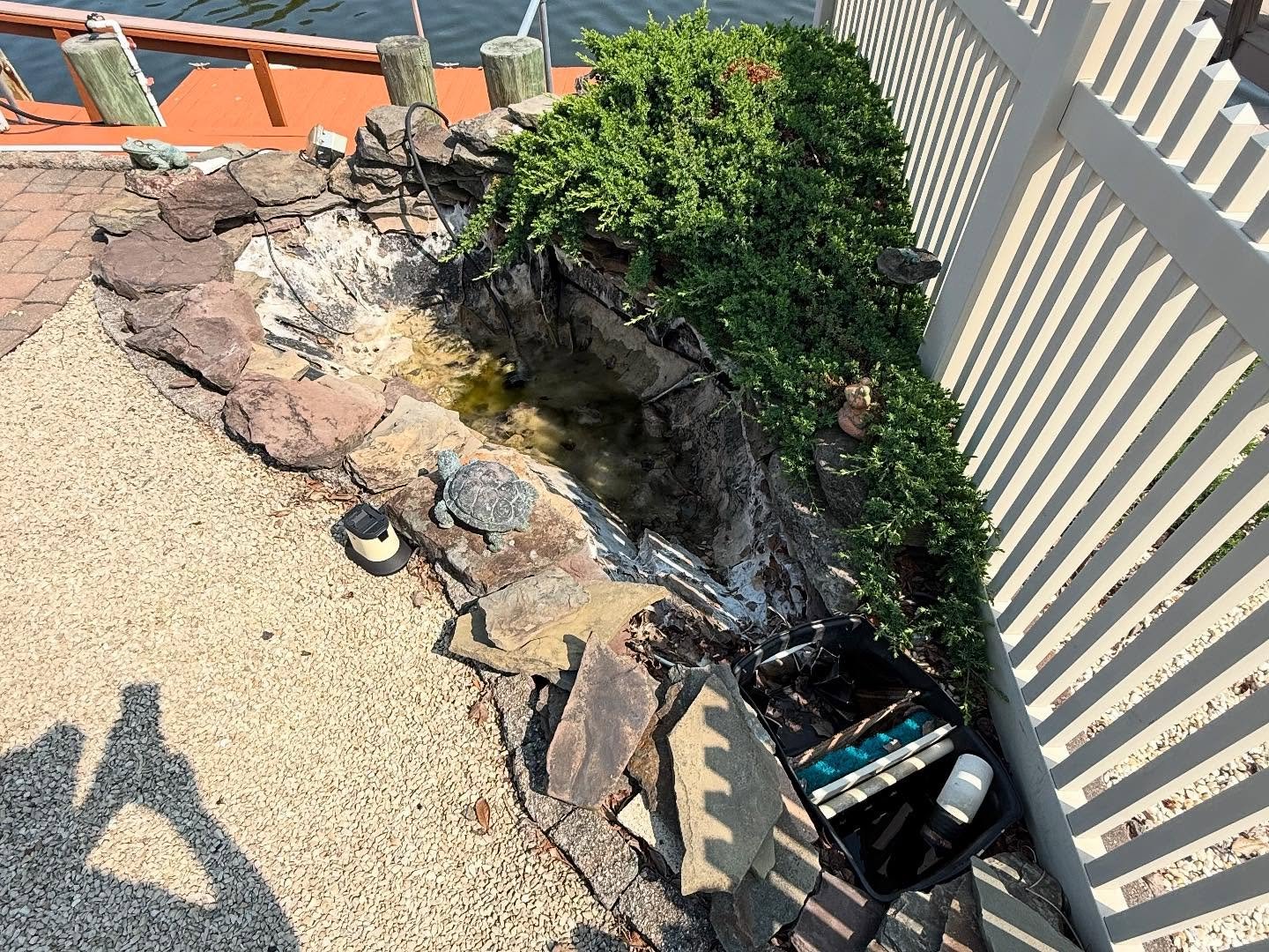 Koi Pond removal, fill and topped with sand!