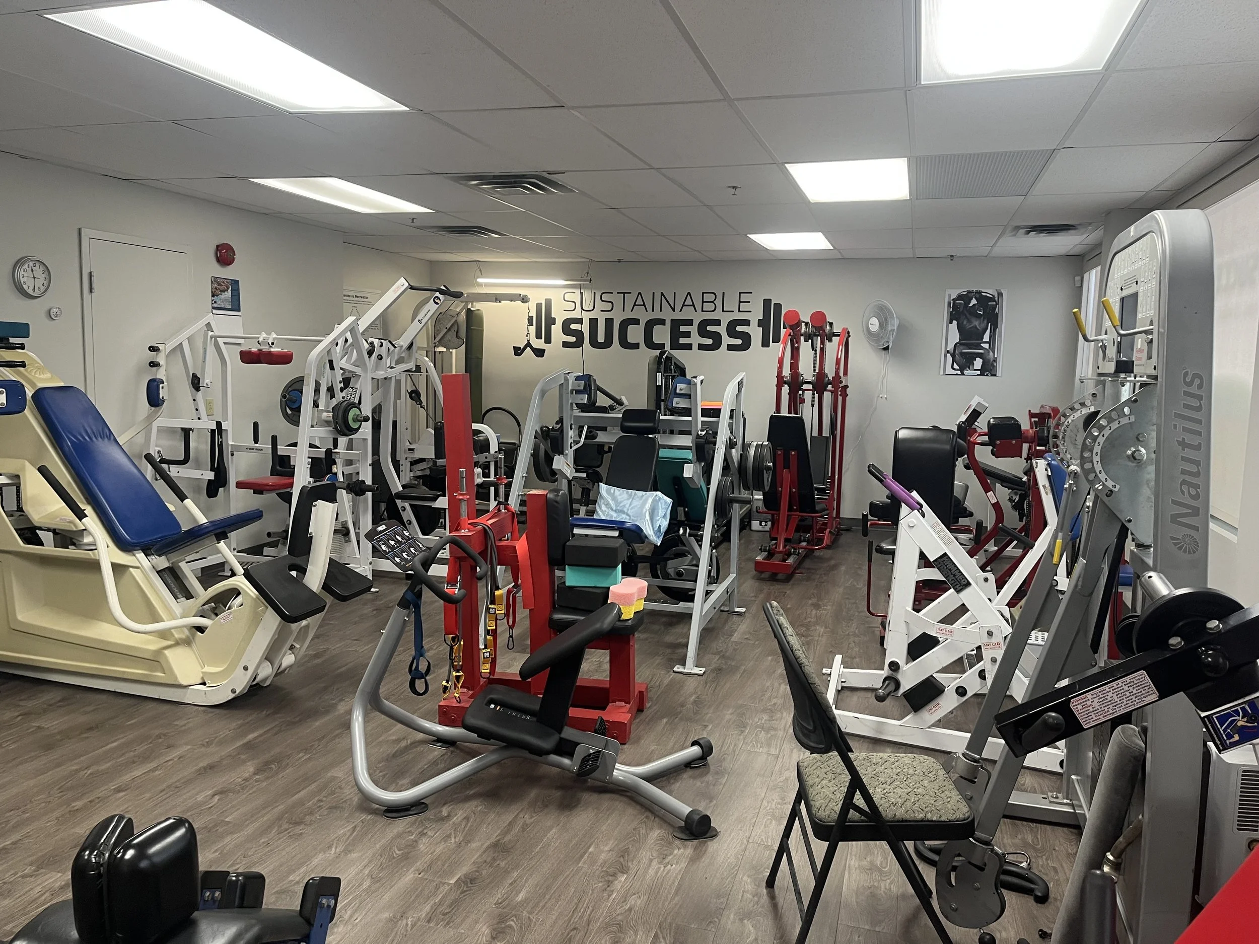 Interior of the Sustainable Success gym studio with wall lettering