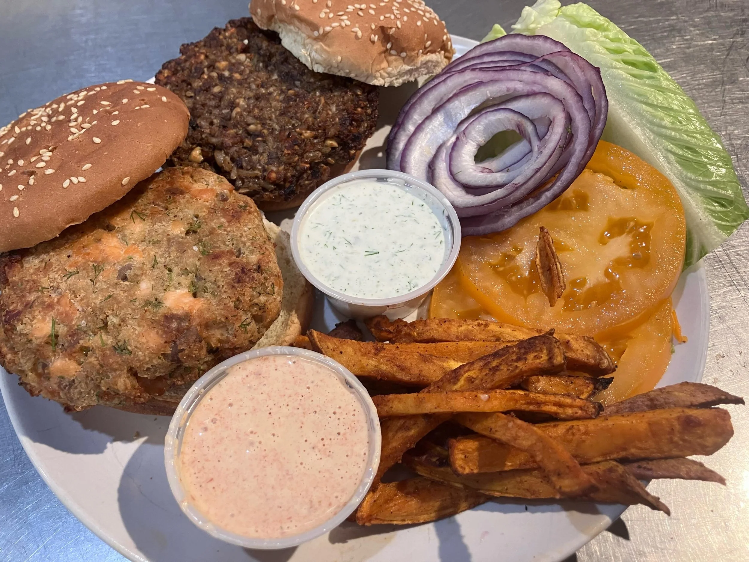 Burgers galore- your choice of lemon dill salmon, vegan mushroom and brown rice, beef or turkey Mediterranean burger with all the fixins. Side of crispy sweet potato fries with chipotle dipping sauce and garlicky potato salad.