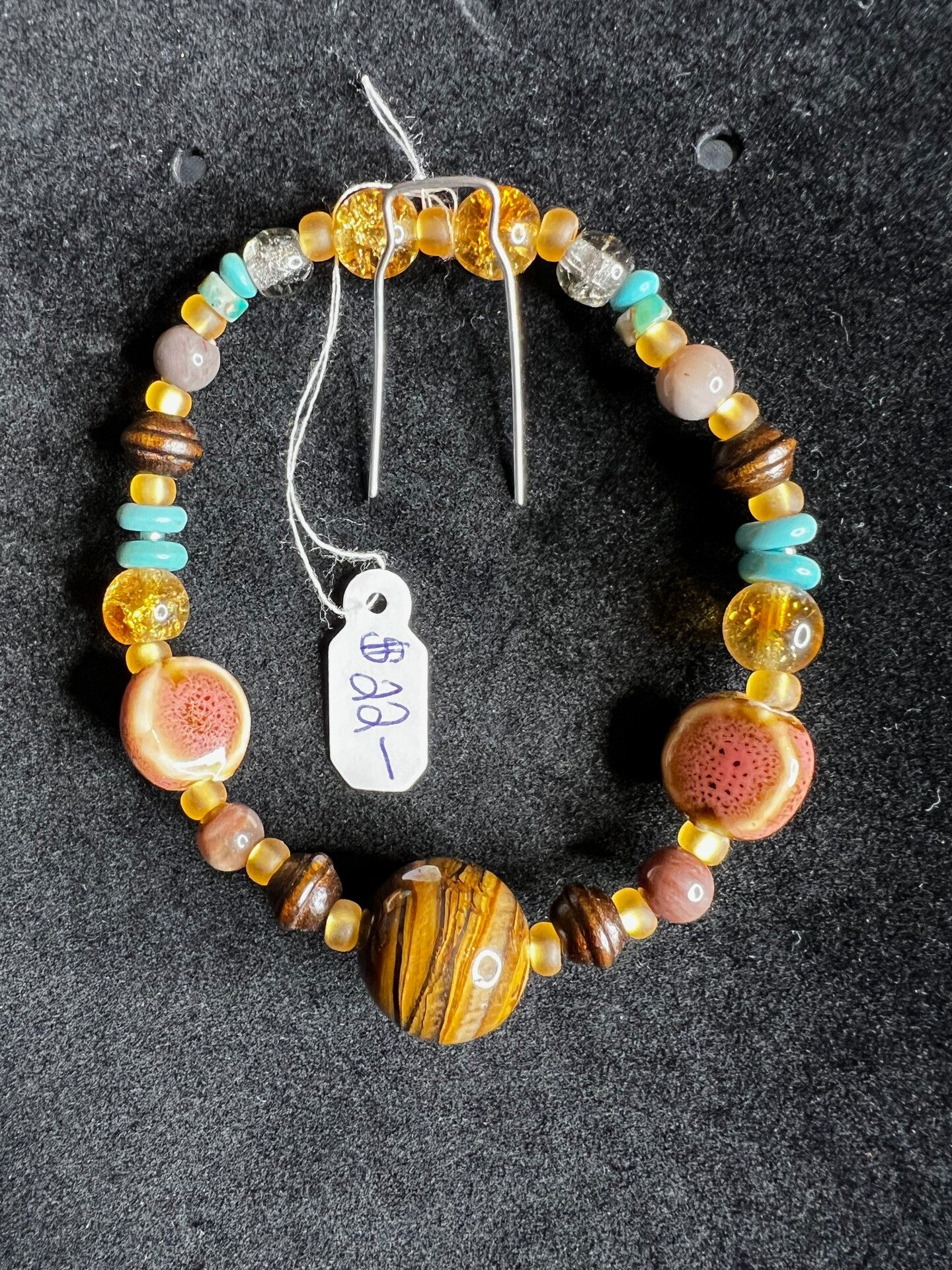 Glass wood and ceramic bead bracelet.jpg