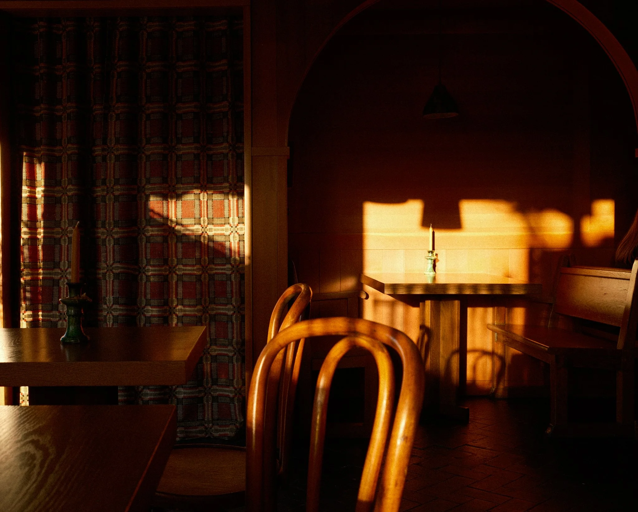 Photos of chairs during golden hour inside a restaurant