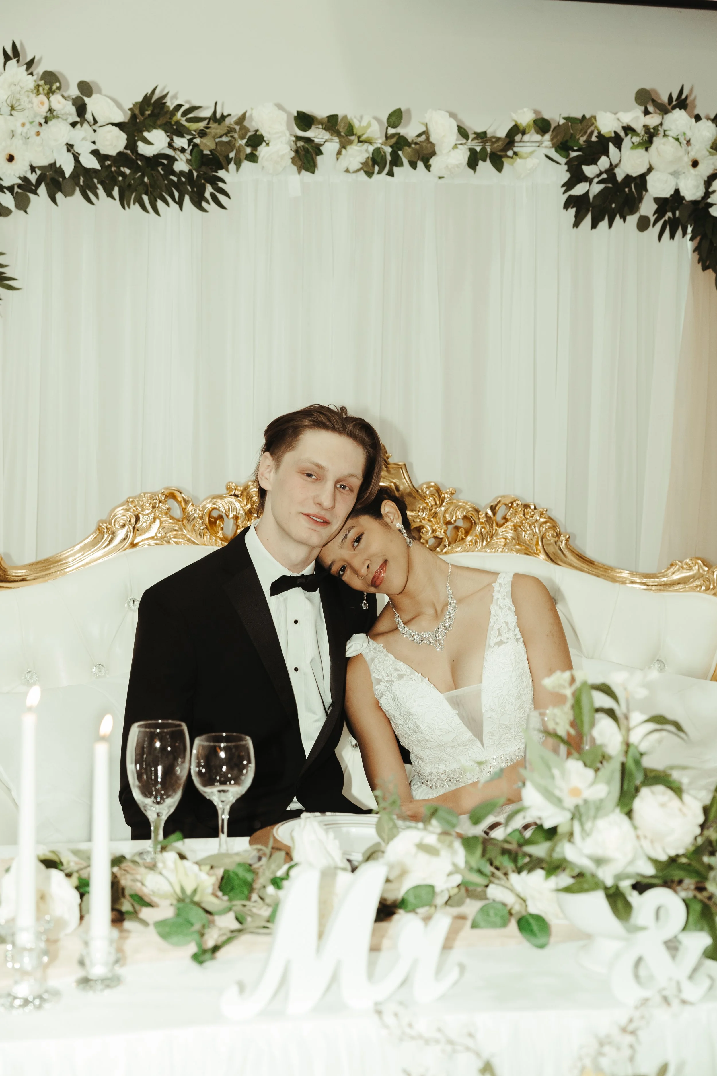 Bride and groom celebrating in the main hall at LuxeFalls Wedding Venue in Sioux Falls SD, showcasing elegant décor and all-inclusive Saturday rental package.