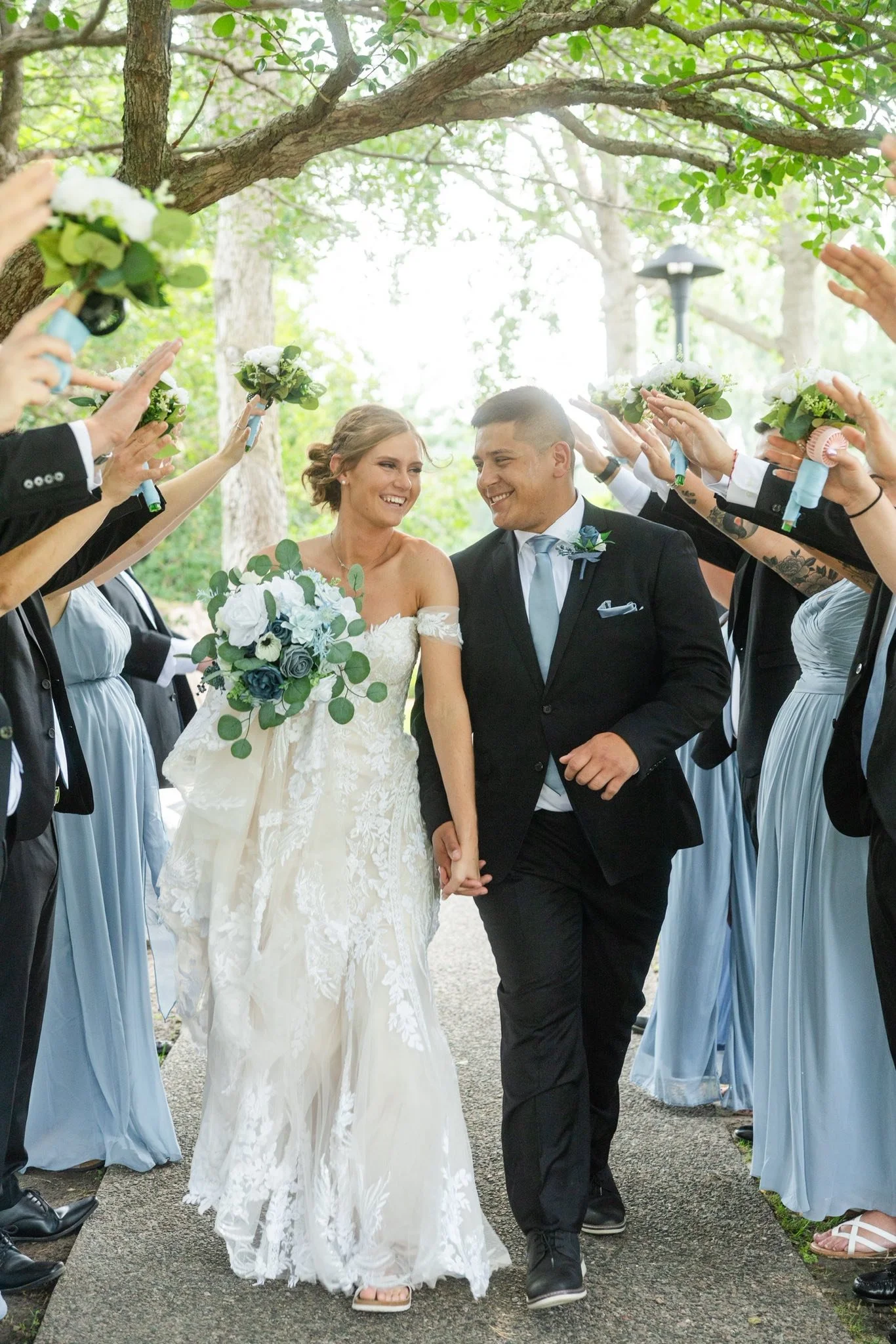 Jen and Ben celebrating their wedding at LuxeFalls Venue, a modern Sioux Falls wedding venue offering elegant indoor and outdoor event spaces.