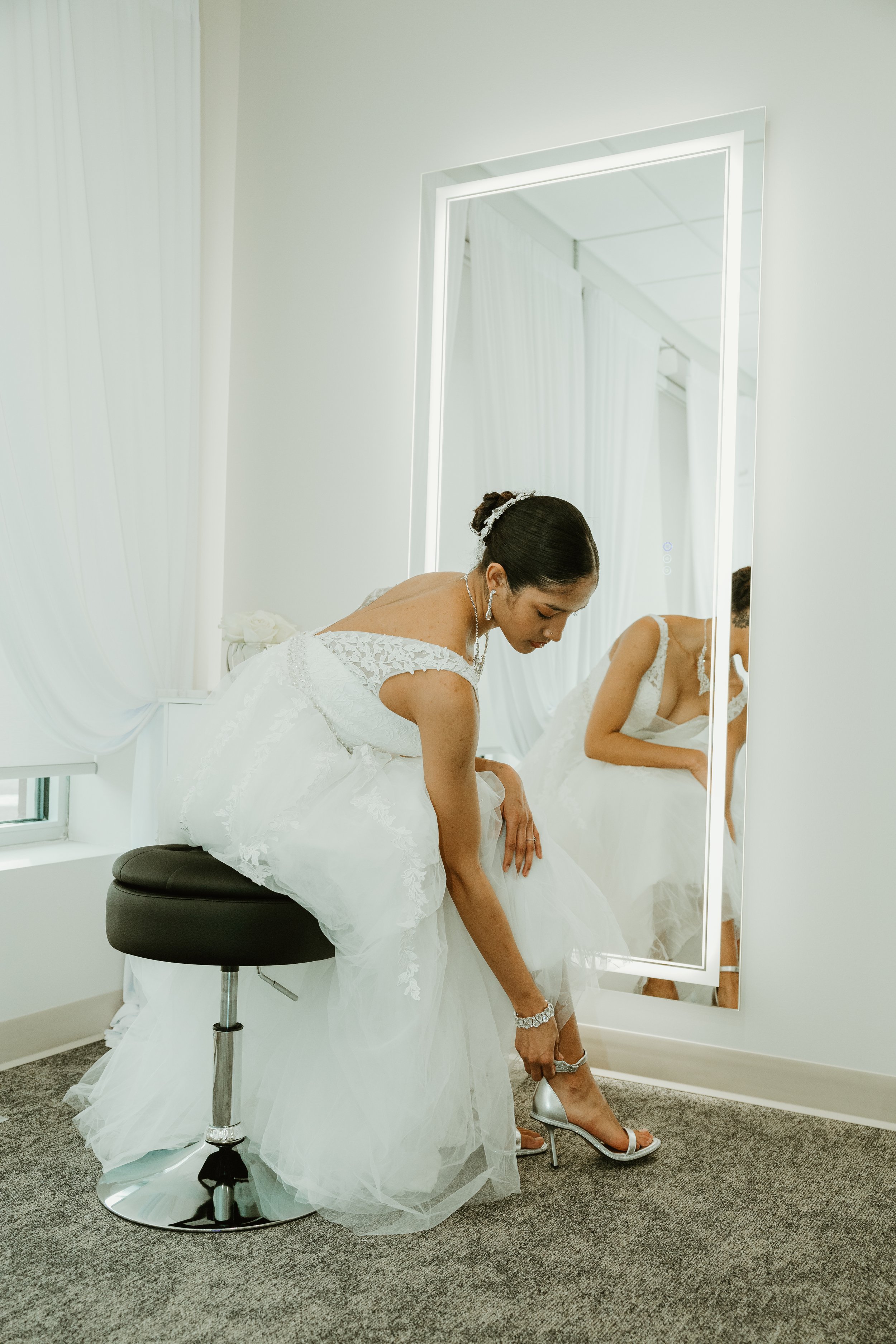 Bride preparing for her wedding in the bridal suite at LuxeFalls Wedding Venue in Sioux Falls SD, highlighting the Sunday rental option for intimate celebrations and receptions.