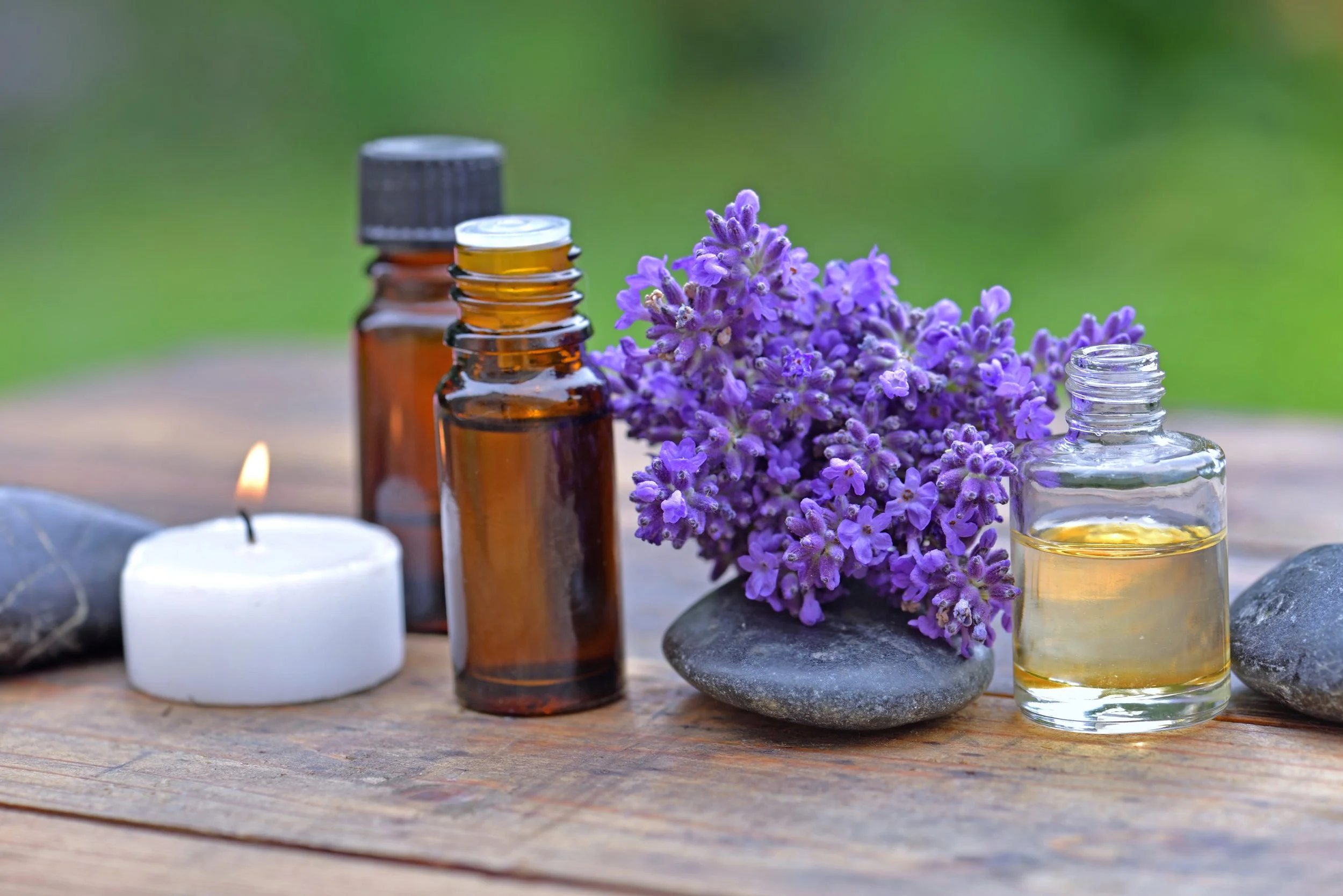 bottle-essential-oil-bouquet-lavender-flower-arranged-wooden-table-with-candle.jpg