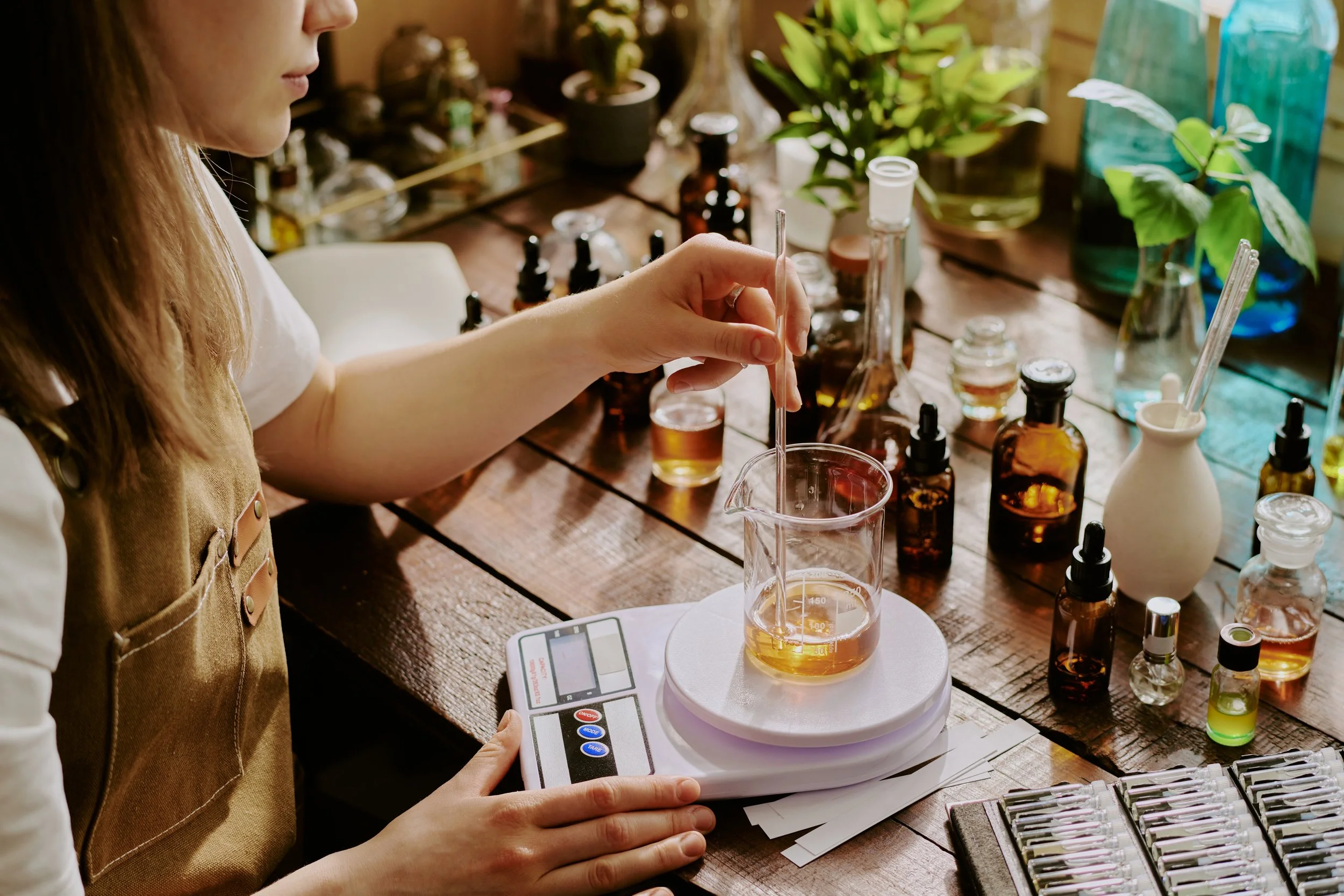 young-perfumer-blending-essential-oils.jpg