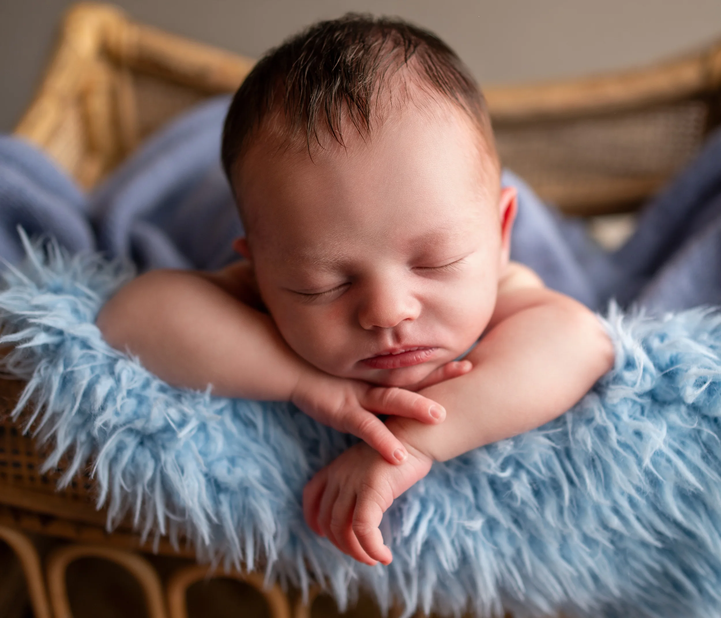 baby boy posed in chin on hands pose during studio session with raleigh newborn photographer