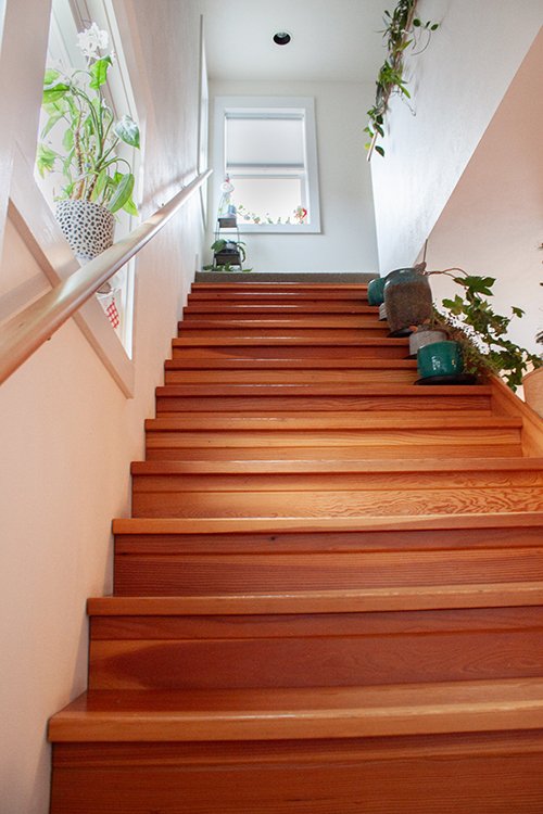 We loved building these beautiful wood stairs leading up to the client's master bedroom. The natural light filling the stairwell shows them off beautifully.