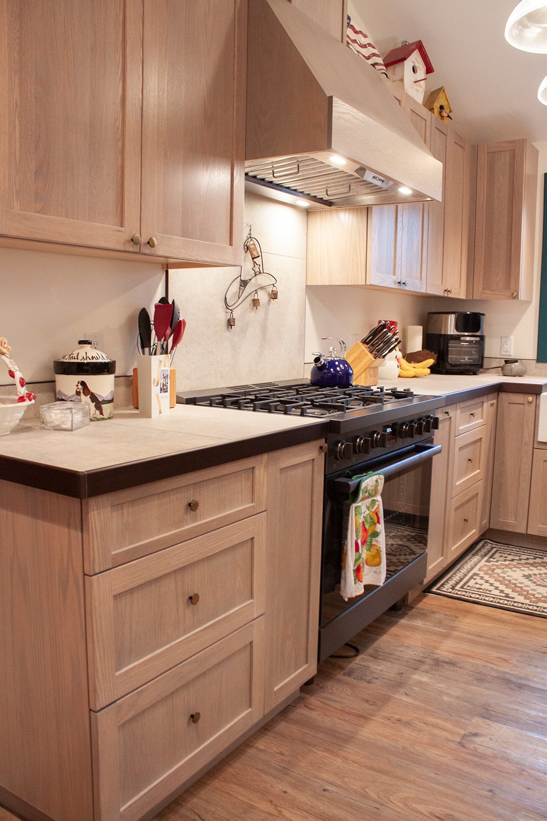 We completely remodeled the kitchen for better handicap access by adjusting the flow of the space, as well as increasing distance between the cabinets and dining table to allow a wheelchair to fit through. We kept the clean, rustic vibe to match the