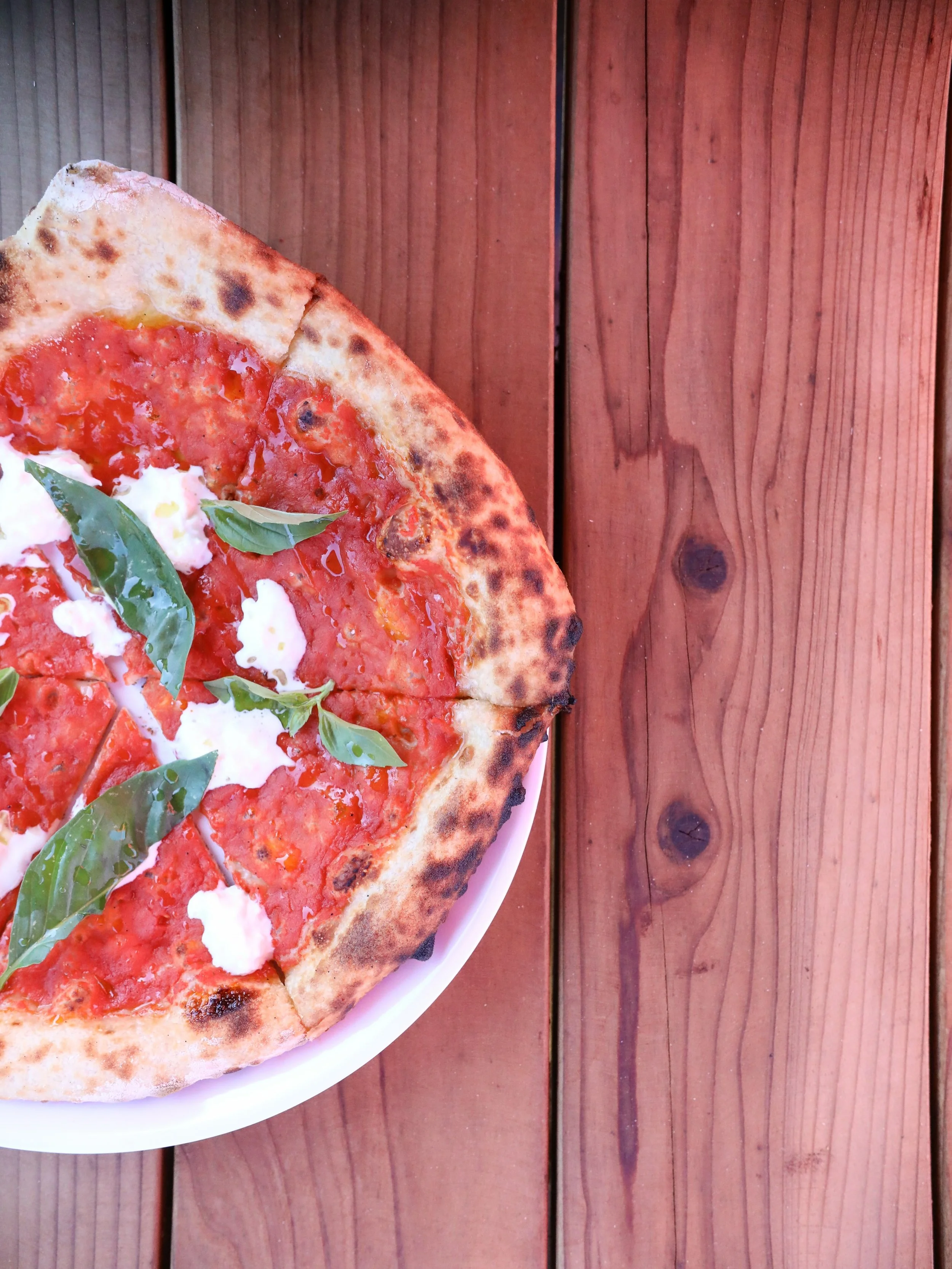 Wood-fired Margherita with a side of Petaluma history.

The mill next door dates back to 1915, and we&rsquo;re pretty lucky to call this our view.

We open at 3 PM. Bring a few friends&mdash;we&rsquo;ll get the pizzas going.