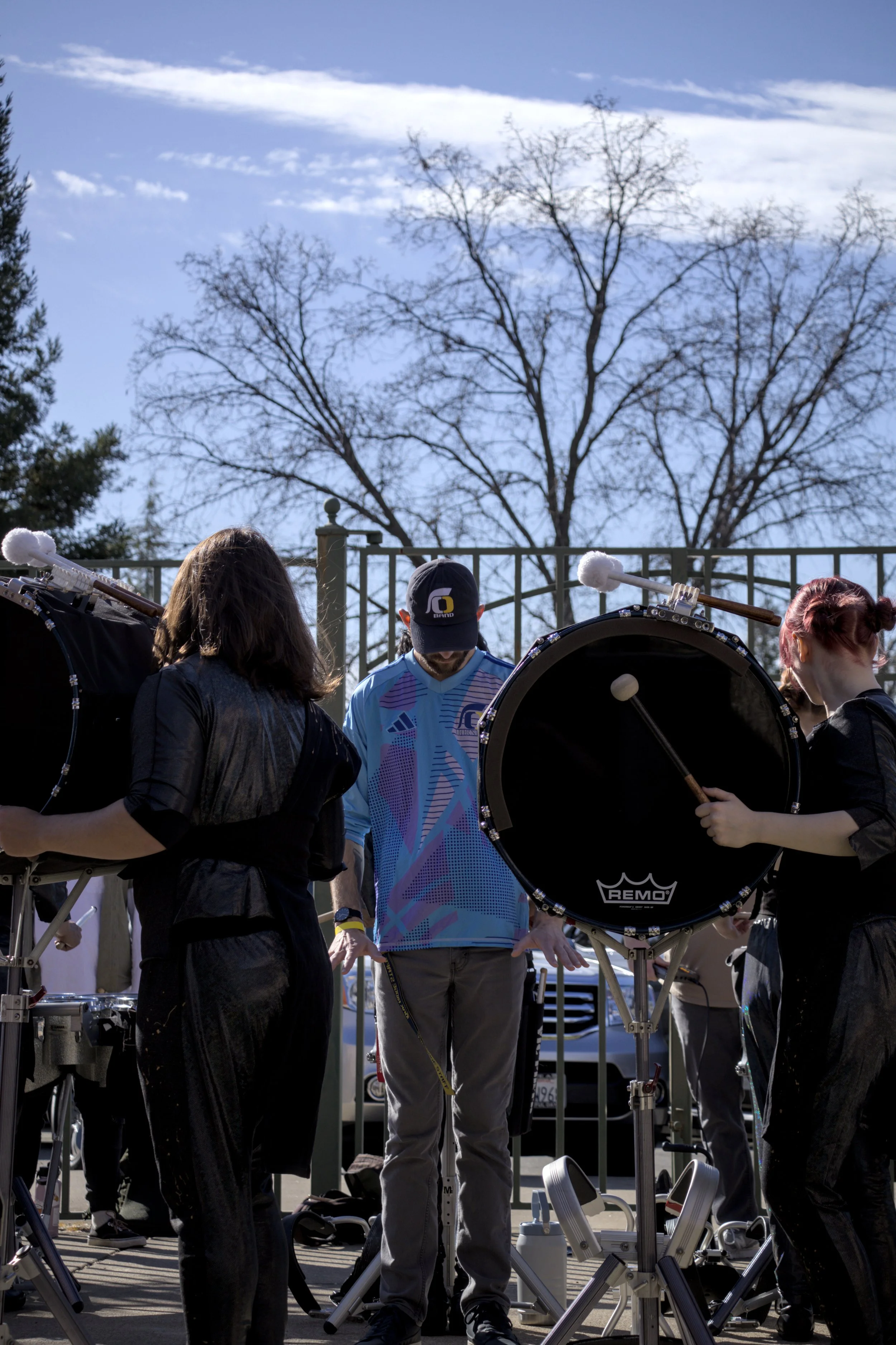 Musicians playing bass drums outdoors