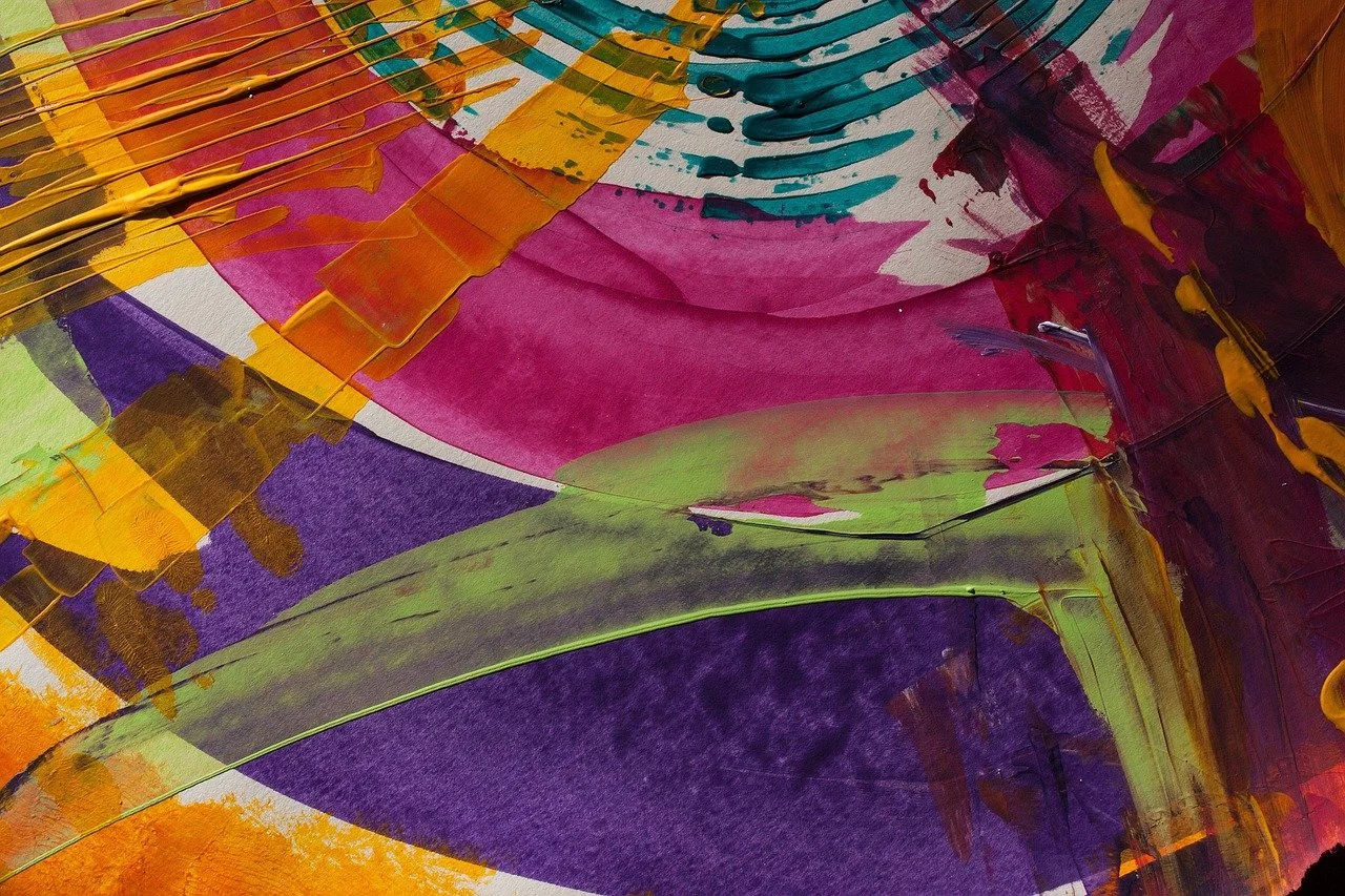 Abstract colorful painting with bold strokes of pink, purple, yellow, green, and blue.