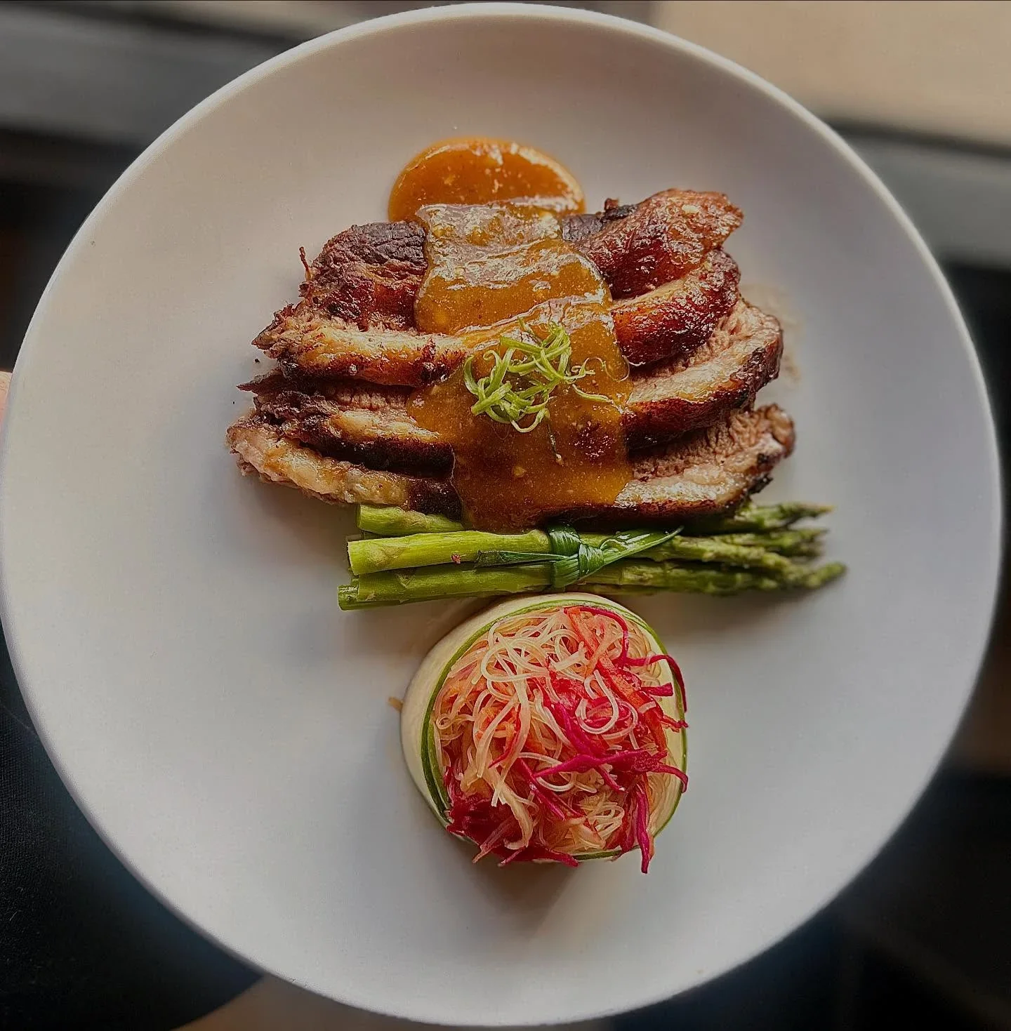  TEKISASU BRISKET on our Spring Menu Texas style, Asian brisket! Nothing but salt and pepper rubbed, and spritzed with our blend of rice wine vinegar, mirin and tamari throughout the smoking process. A bundle of miso-ginger asparagus and sesame noodl