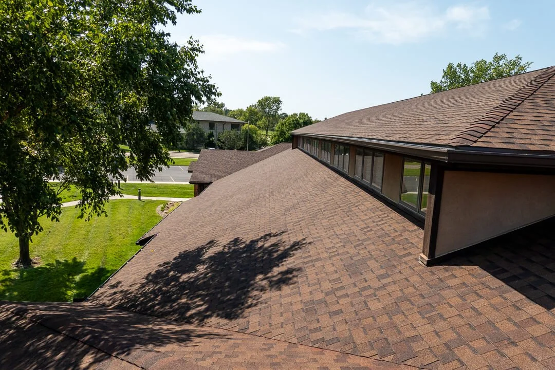 View of new shingle roof on office building