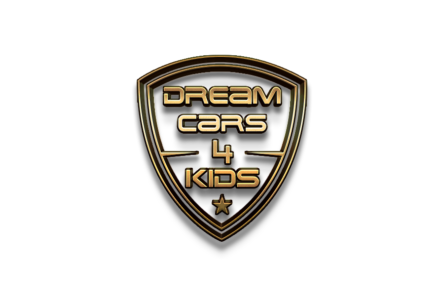 A logo with a gold outline shield shape that says "Dream Cars 4 Kids" inside, against a black background.