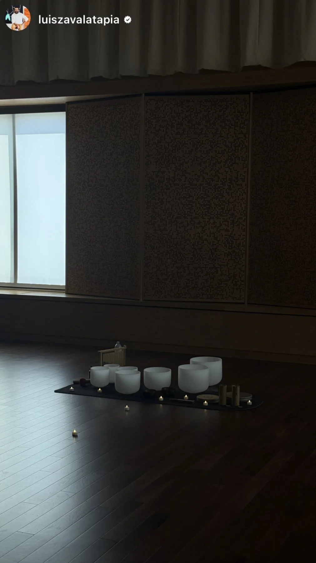 “Sandy Duarte leading a sound bath at a women’s wellness retreat with crystal singing bowls.”