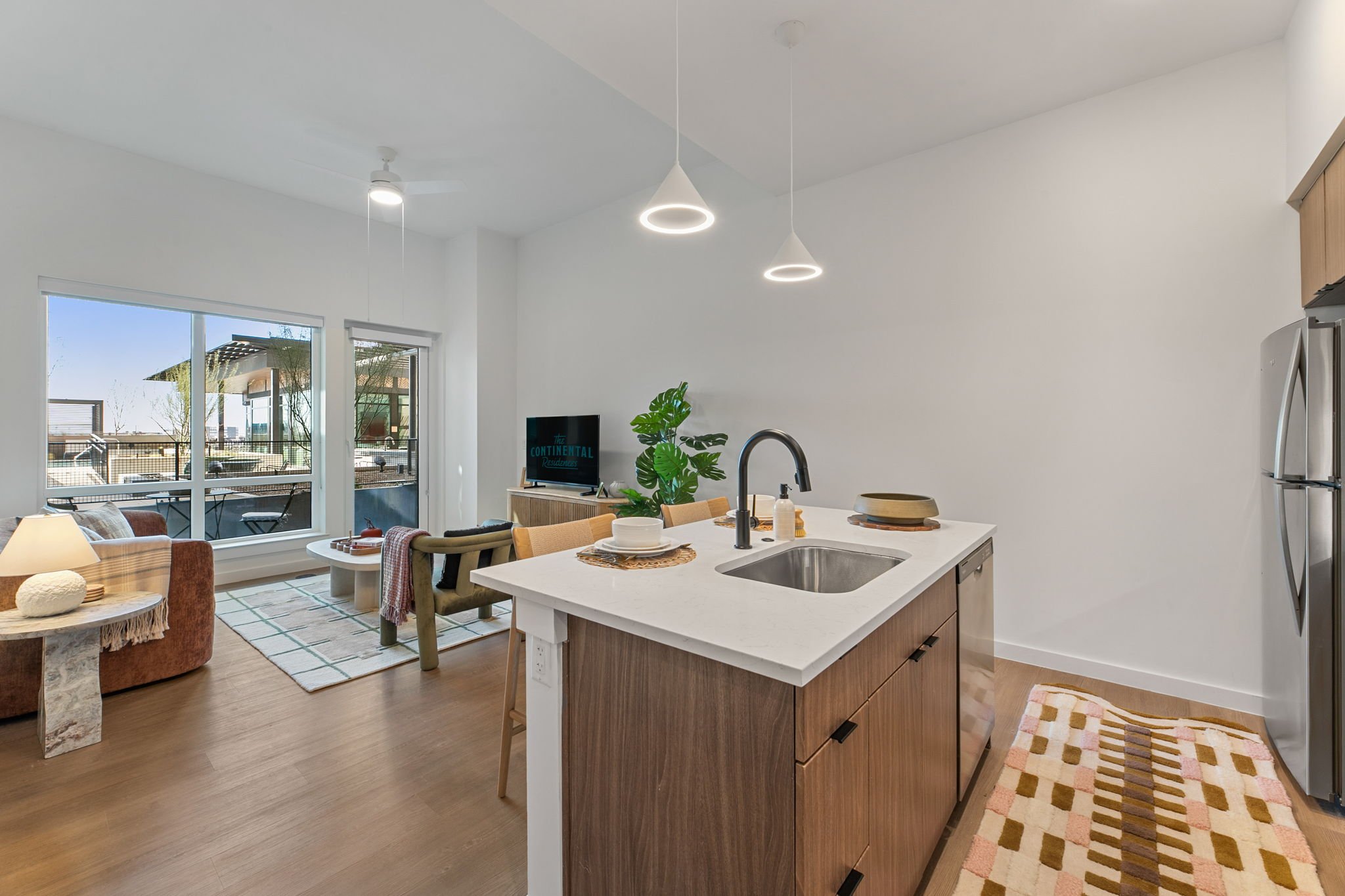 Contemporary Continental Residences interior living space with modern furniture and lighting