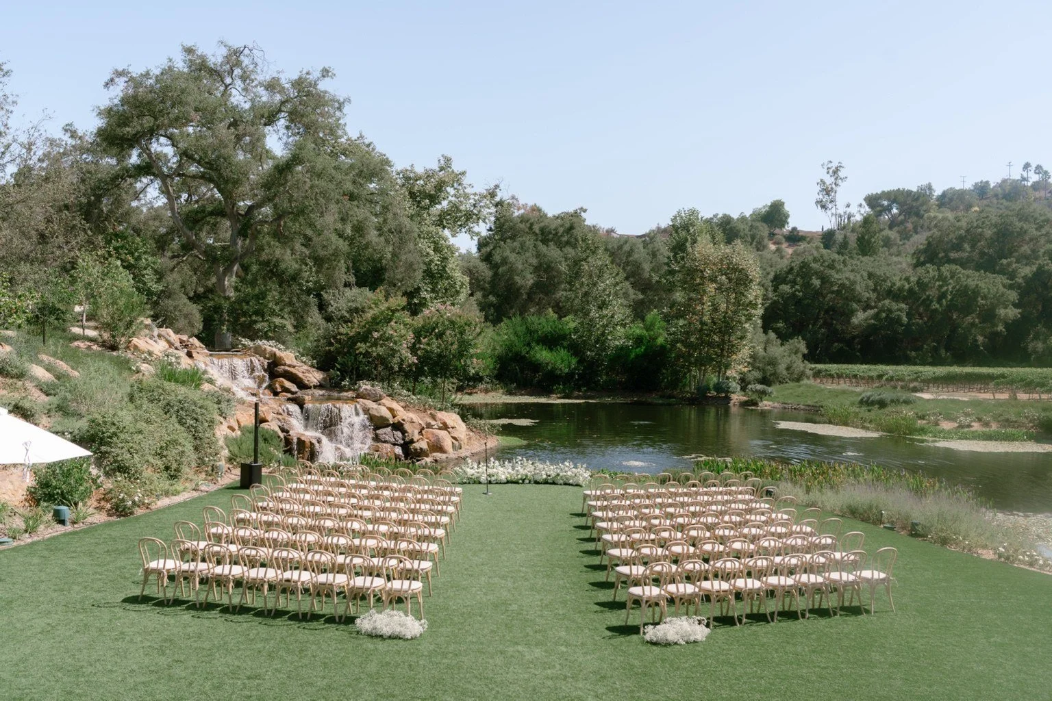 A lakeside ceremony setup in Monserate Winery, a San Diego wedding venue