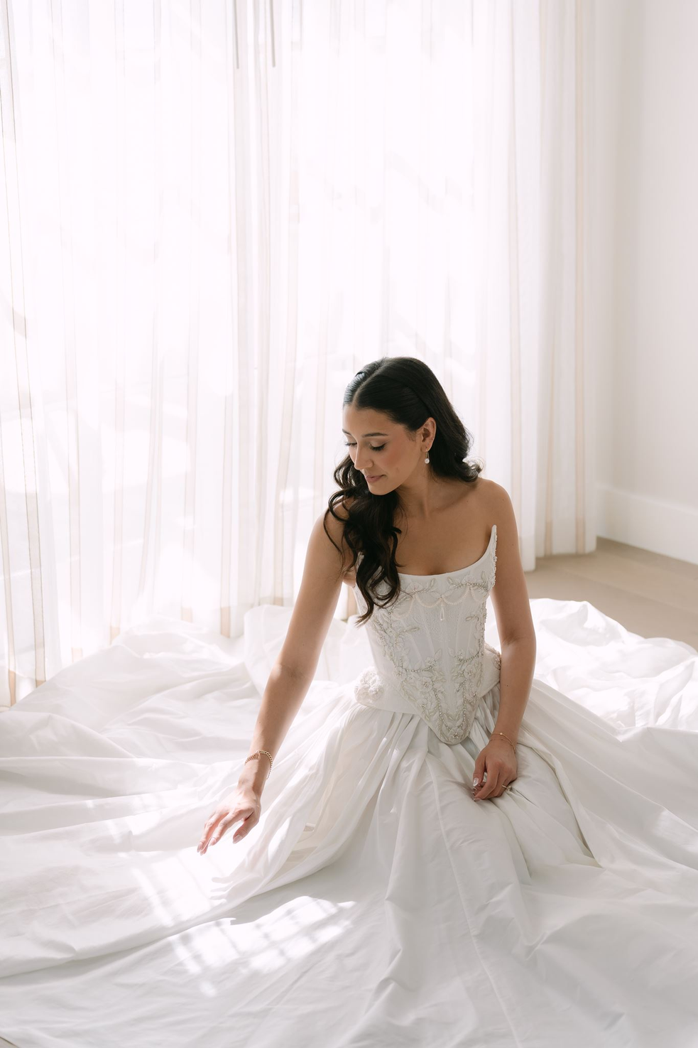 hotel-del-coronado-wedding-bride-seated-in-gown.webp