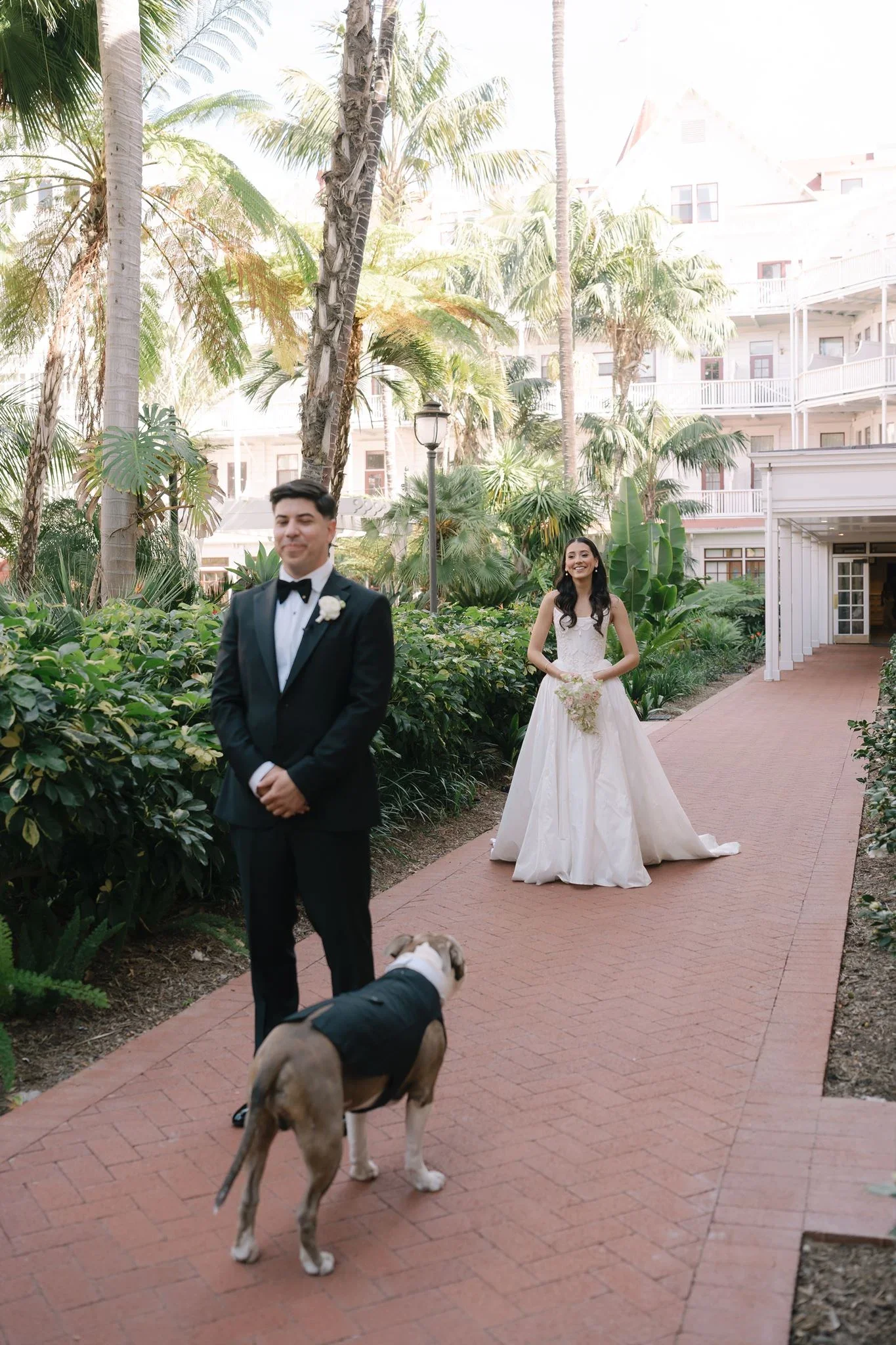 hotel-del-coronado-wedding-bride-groom-dog-first-look.webp