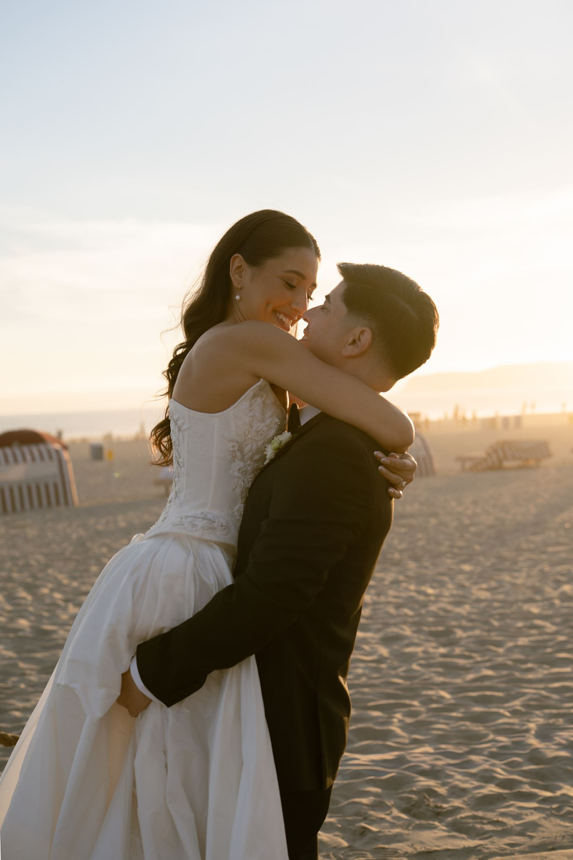 hotel-del-coronado-wedding-sunset-beach-embrace.webp