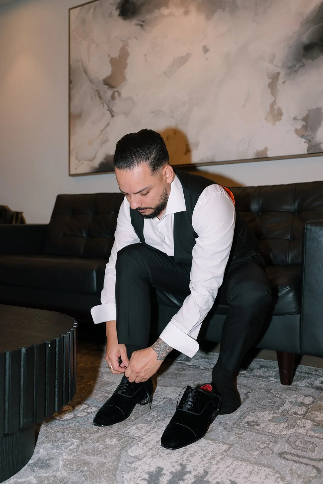 Groom getting ready in tuxedo before Monserate Winery wedding