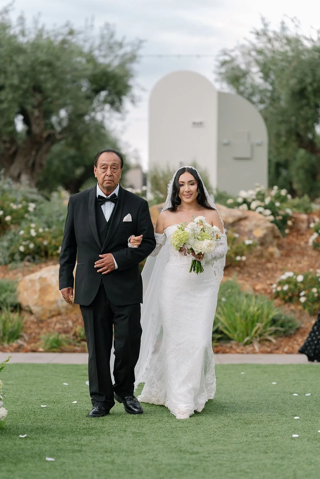 Bride walking down the aisle with her father at Monserate Winery