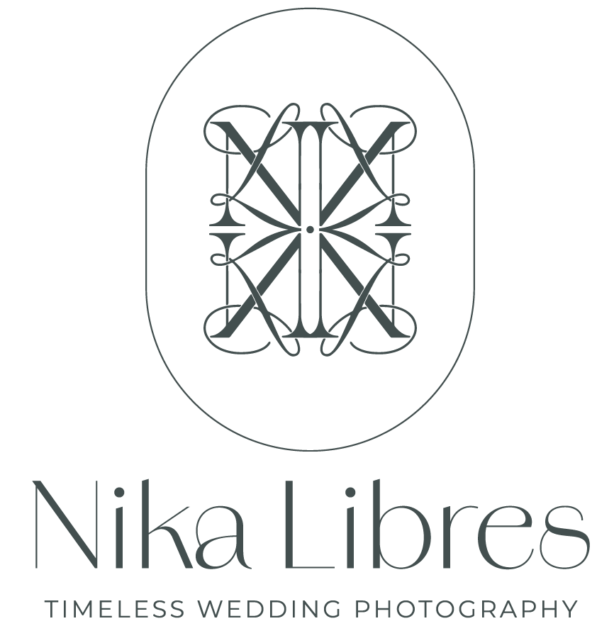 Logo for Nika Libres Timeless Wedding Photography featuring monogram with intricate decorative letters enclosed in an oval.