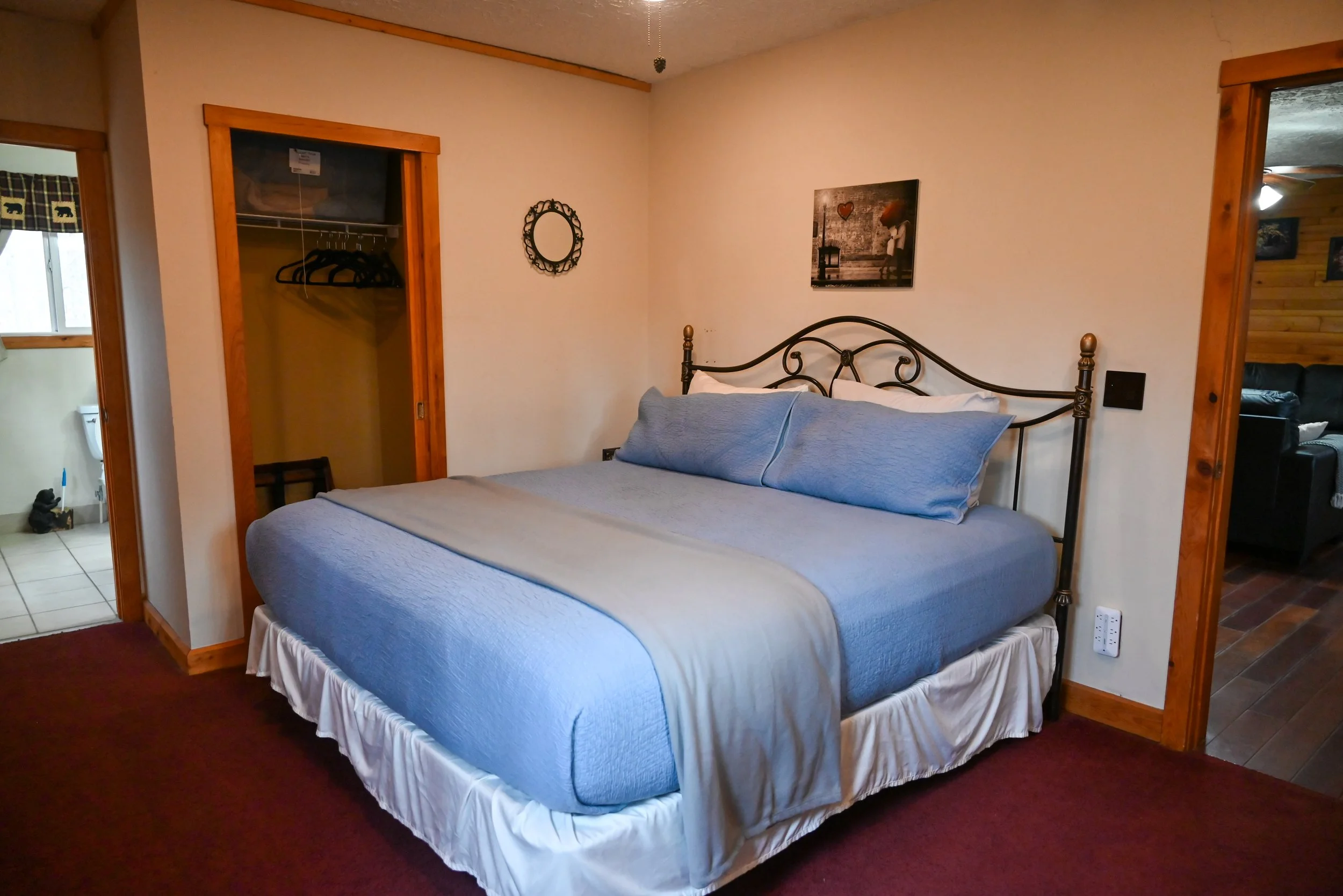 Inviting a king‑size bed at Beary Cozy Cabin, offering couples a spacious, romantic place to relax during their Hocking Hills getaway.”