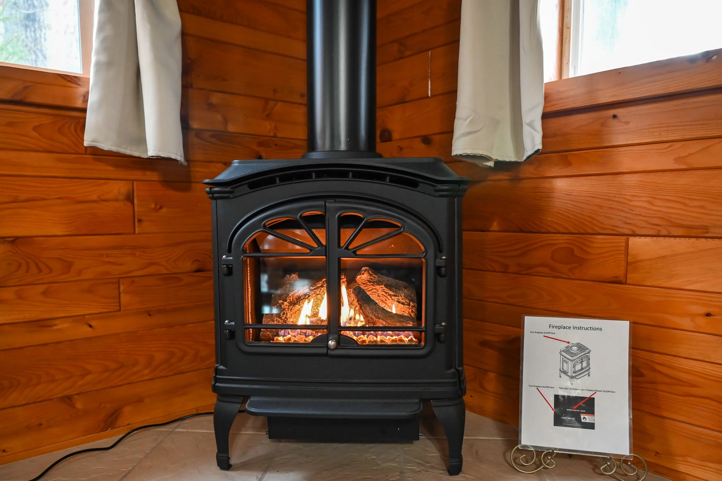 Cozy gas fireplace glowing warmly inside Beary Cozy Cabin, creating the perfect romantic ambiance for couples in Hocking Hills.