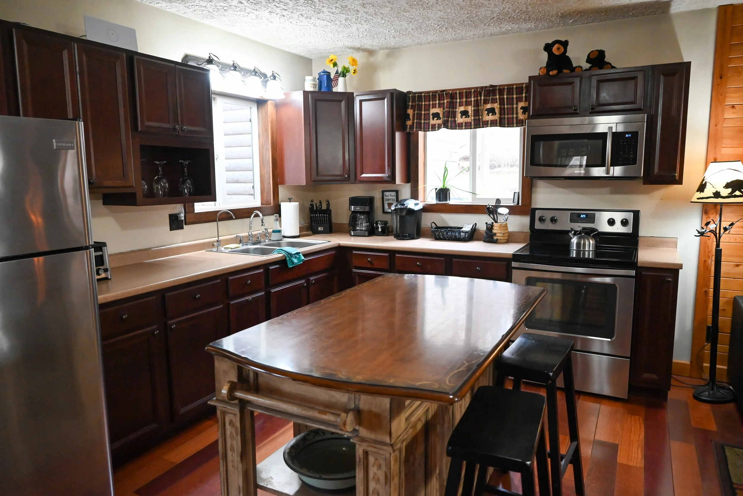 Warm, rustic kitchen at Beary Cozy Cabin, where couples can cook together and share intimate meals during their romantic Hocking Hills escape.