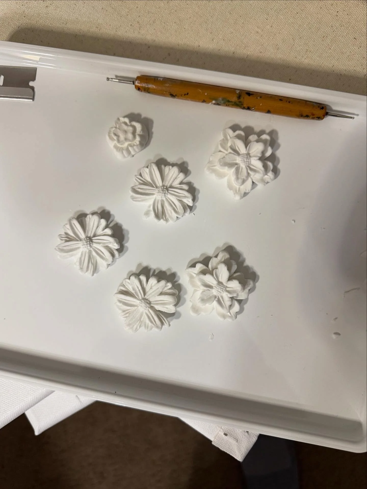 Working on clay flowers to add some dimension to honey the Highlander paint party on Saturday. Want to give my guest some options to decorate her .