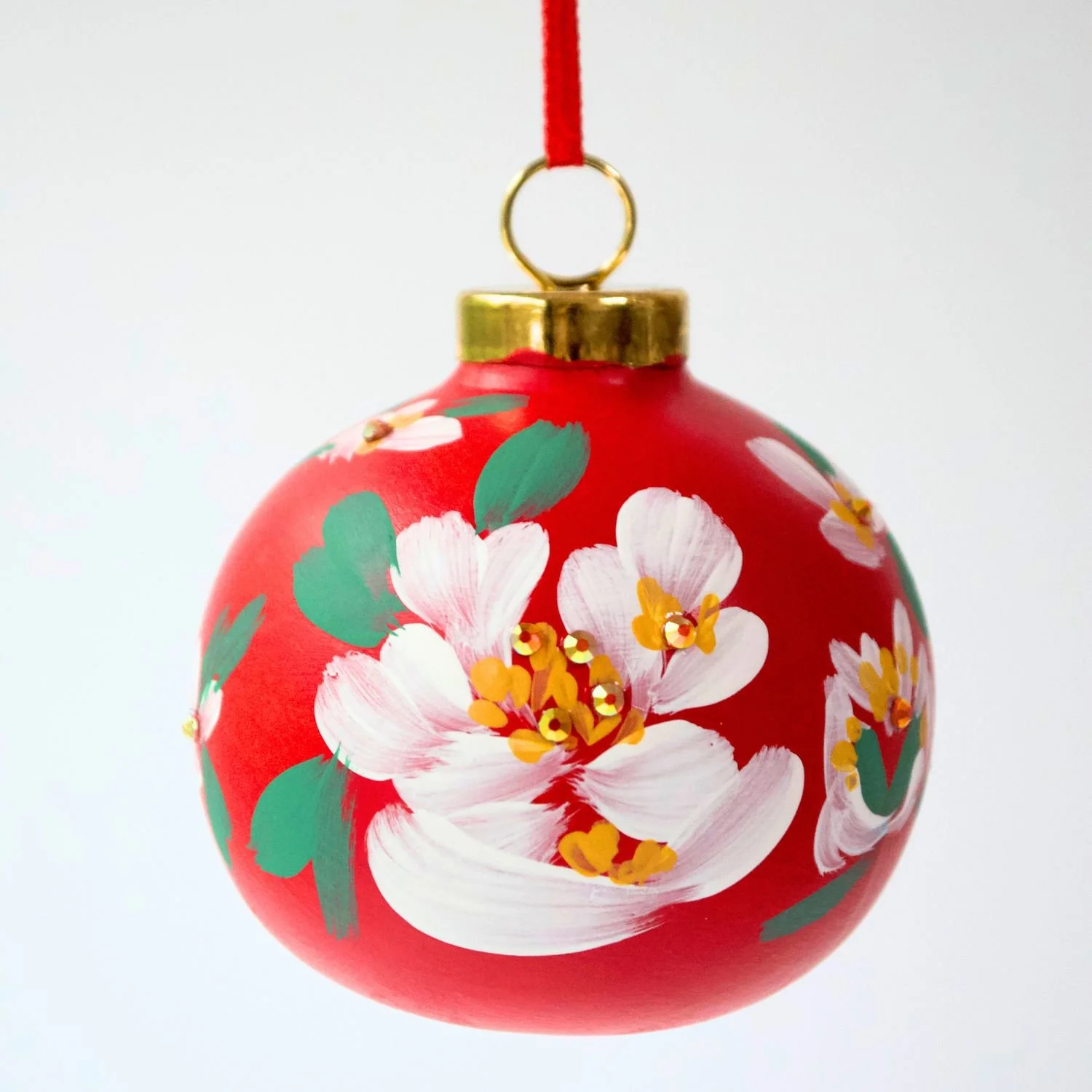 red-white-floral-small-round-ceramic-ornament-close-up-maggie-miller-art-and-design.jpeg
