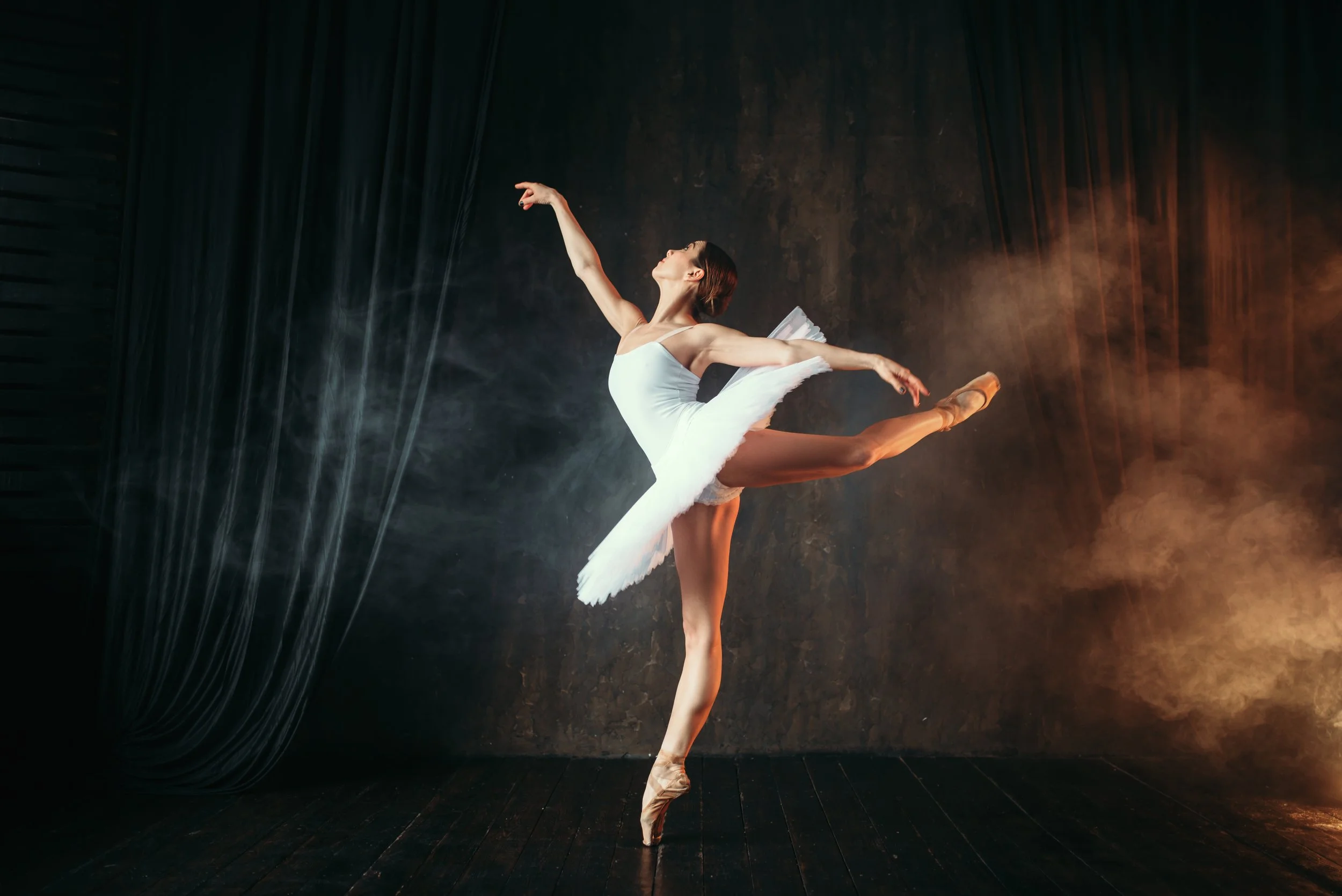 Ballerina posing at an event venue.