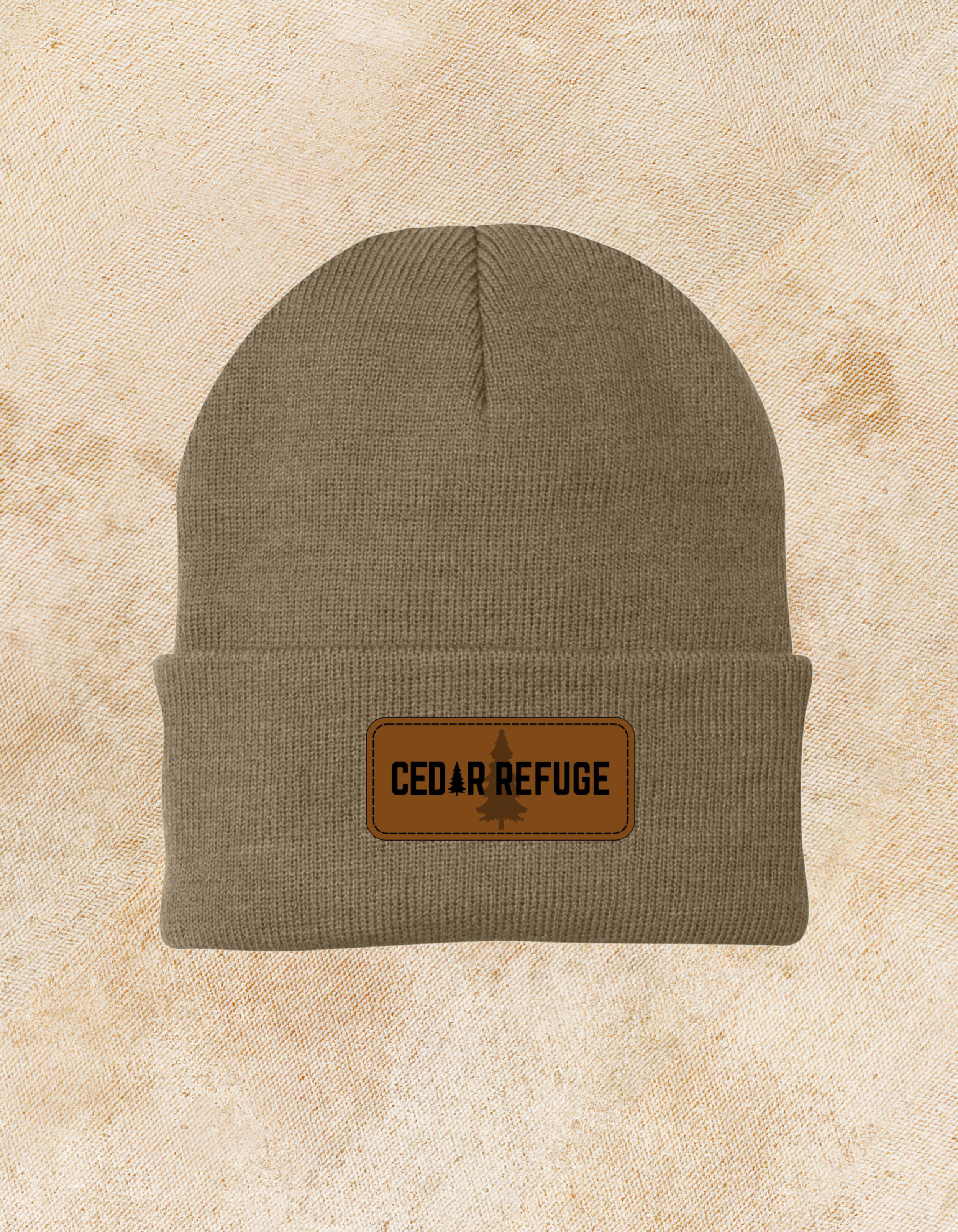 Cedar Refuge tan beanie with faux leather patch and laser-engraved logo