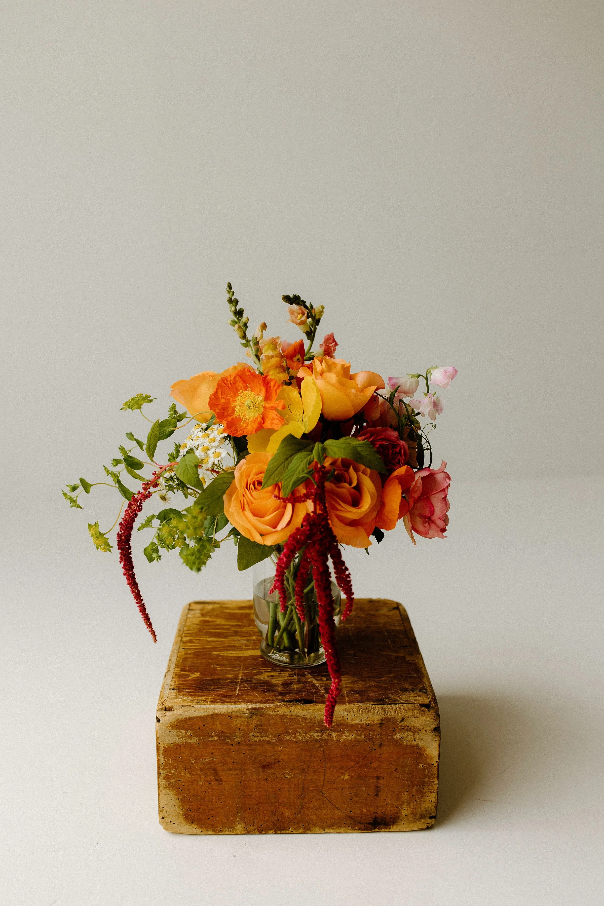 Petite Petals bouquet from the Golden Hour collection, a sweet seasonal gesture with delicate blooms in apricot and pink tones.