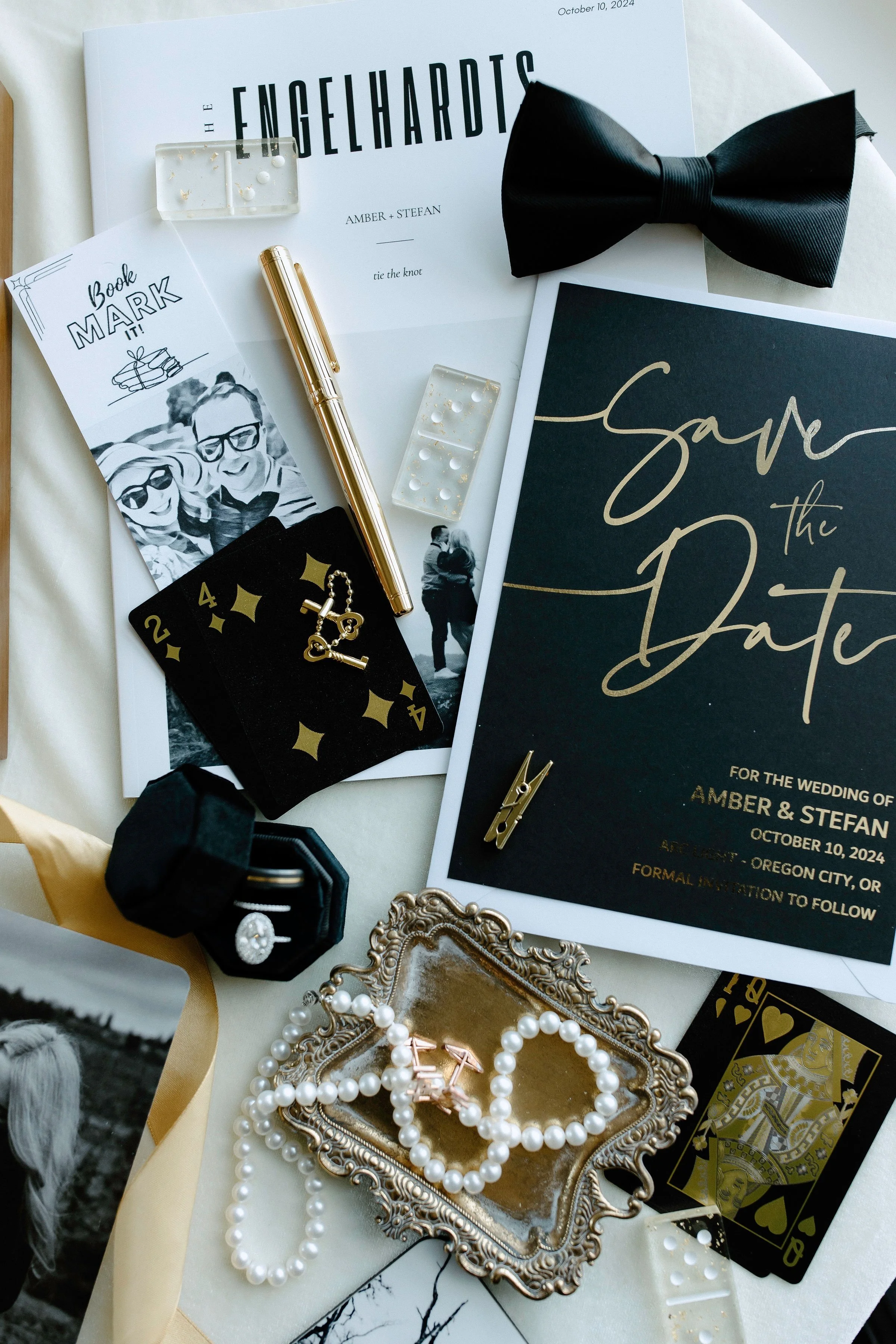 Groom’s details styled with timeless accents — bow tie, cufflinks, and invitation layered in a Beam & Bramble signature flat lay