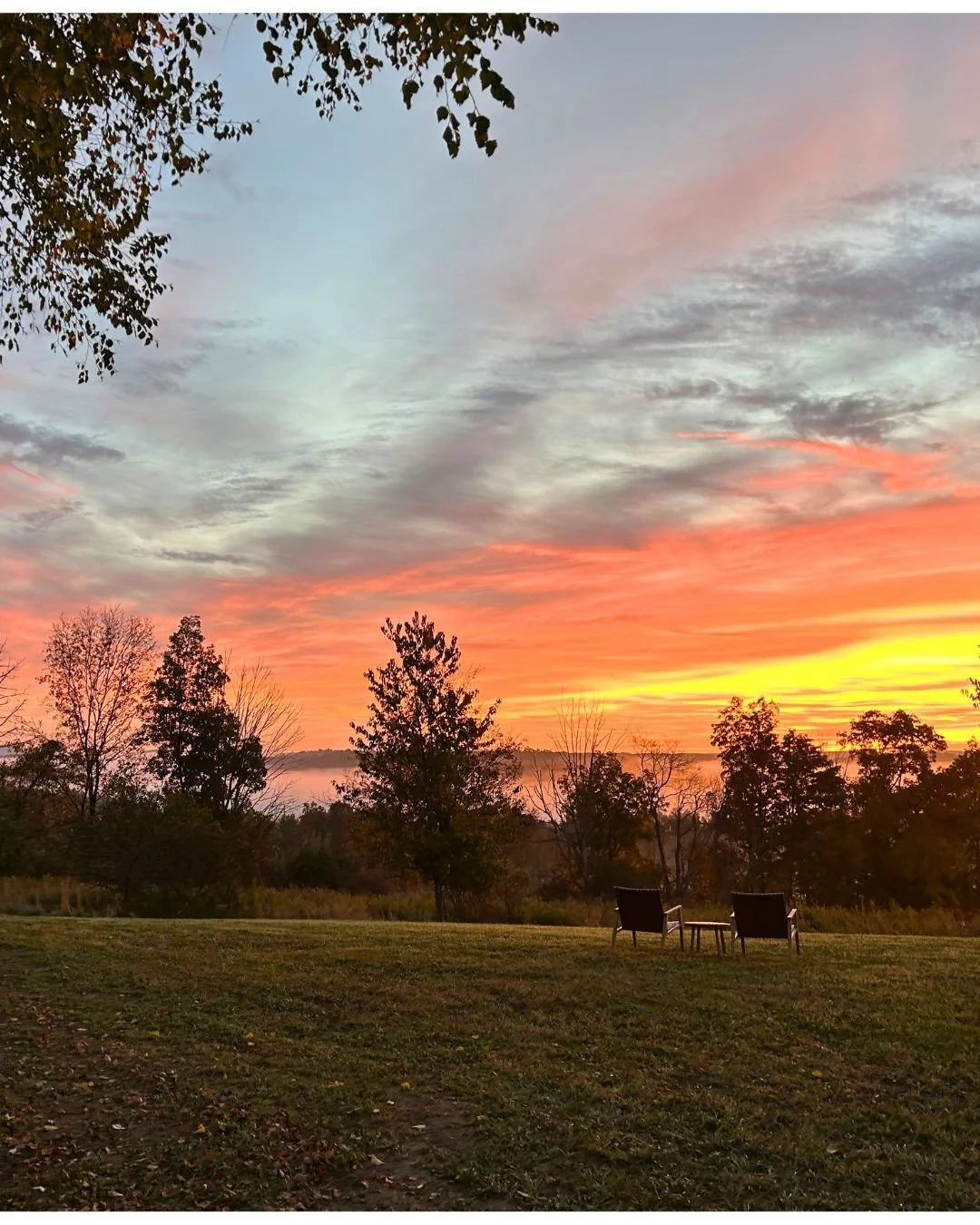 Two chairs overlooking a sunrise at Woodhaven Recovery, reflecting fellowship, mentorship, connection, and the daily practice of recovery.