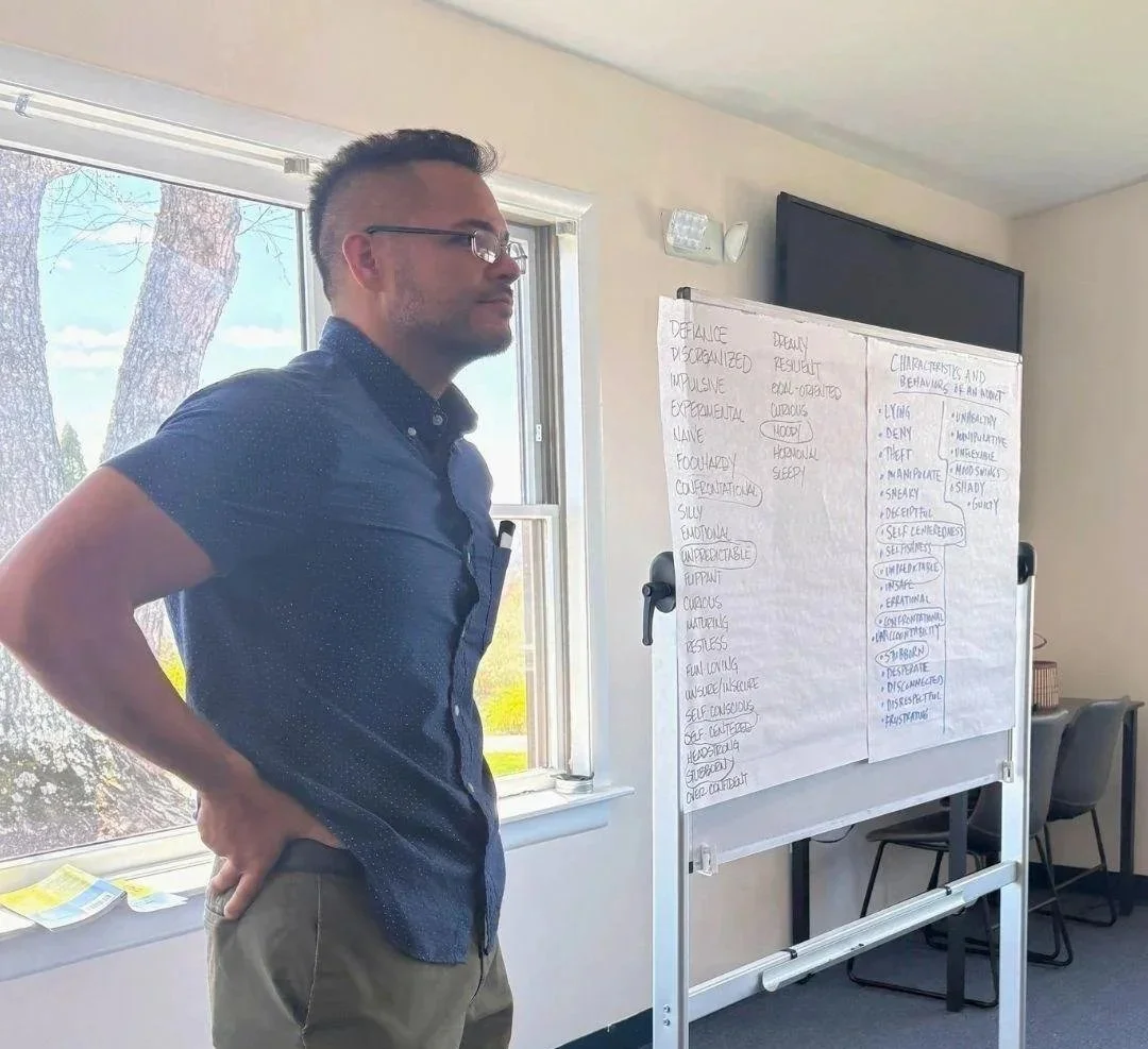 Woodhaven Recovery staff member leads a family education session, helping parents and families better understand recovery, behavior patterns, communication, and the recovery process.