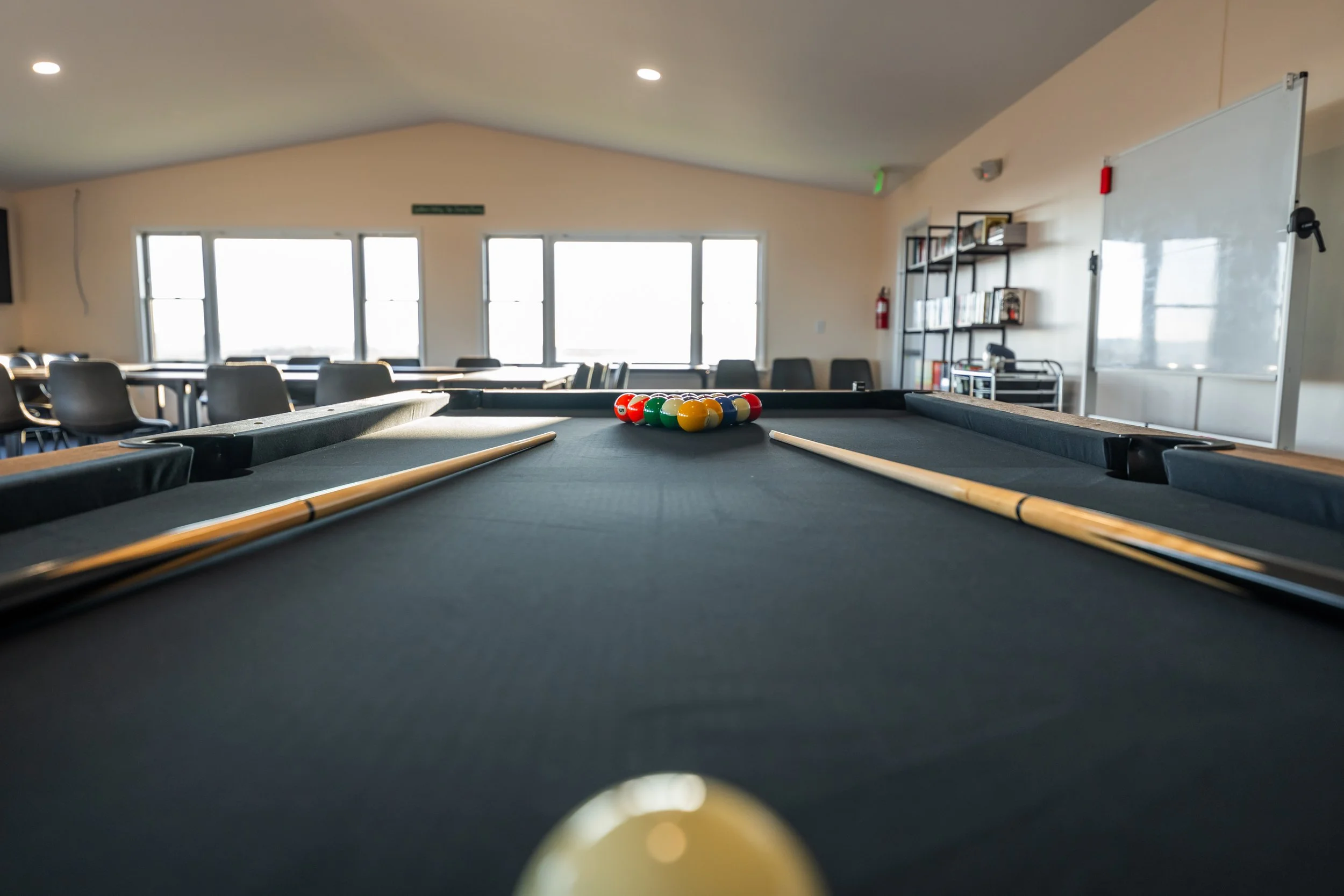 Indoor recreation space at Woodhaven Manor where residents relax, play games, and spend time with peers.