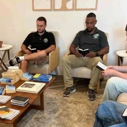 Residents and staff reading recovery literature in Woodhaven’s Zen Den.