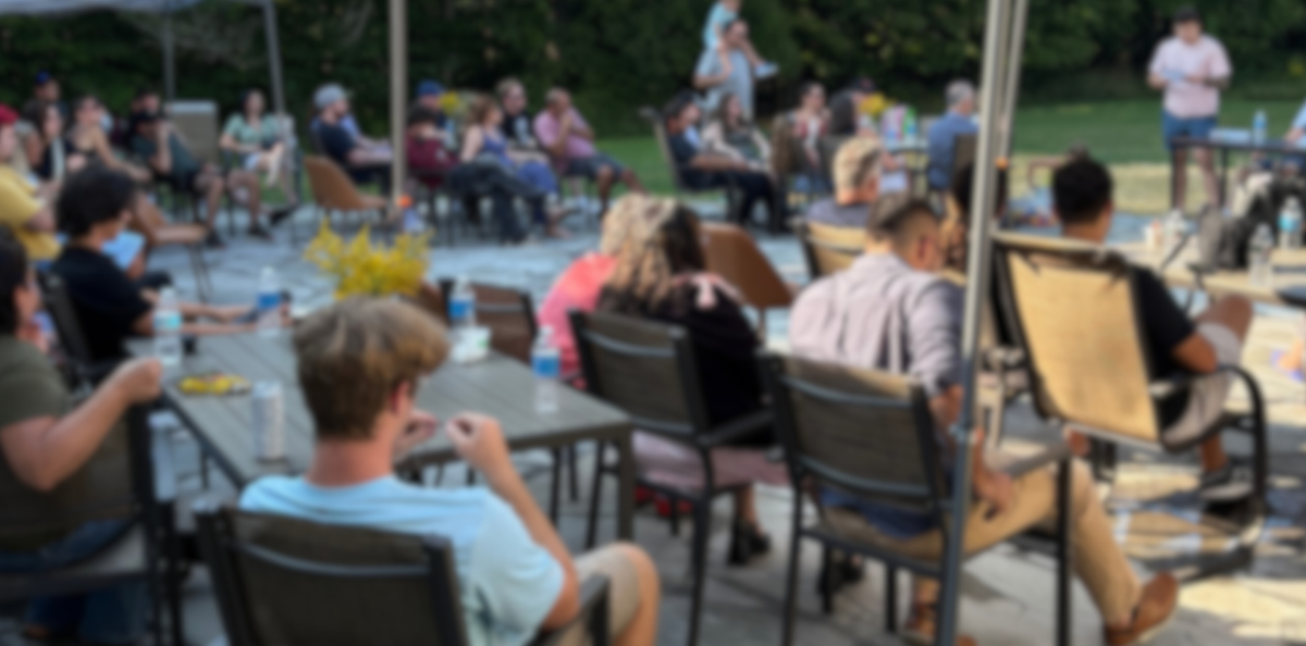 Families, staff, and community gathered outdoors for a Woodhaven Recovery sober celebration and milestone recognition.