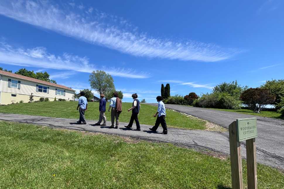Woodhaven Recovery residents walking to Woodhaven Cottage, part of the program’s continuum of care and growing independence.