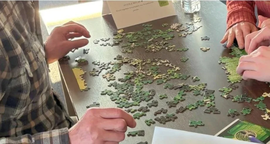 Families and residents work together during a Family Day activity at Woodhaven Recovery, strengthening communication, problem-solving skills, and connection through shared experiences.